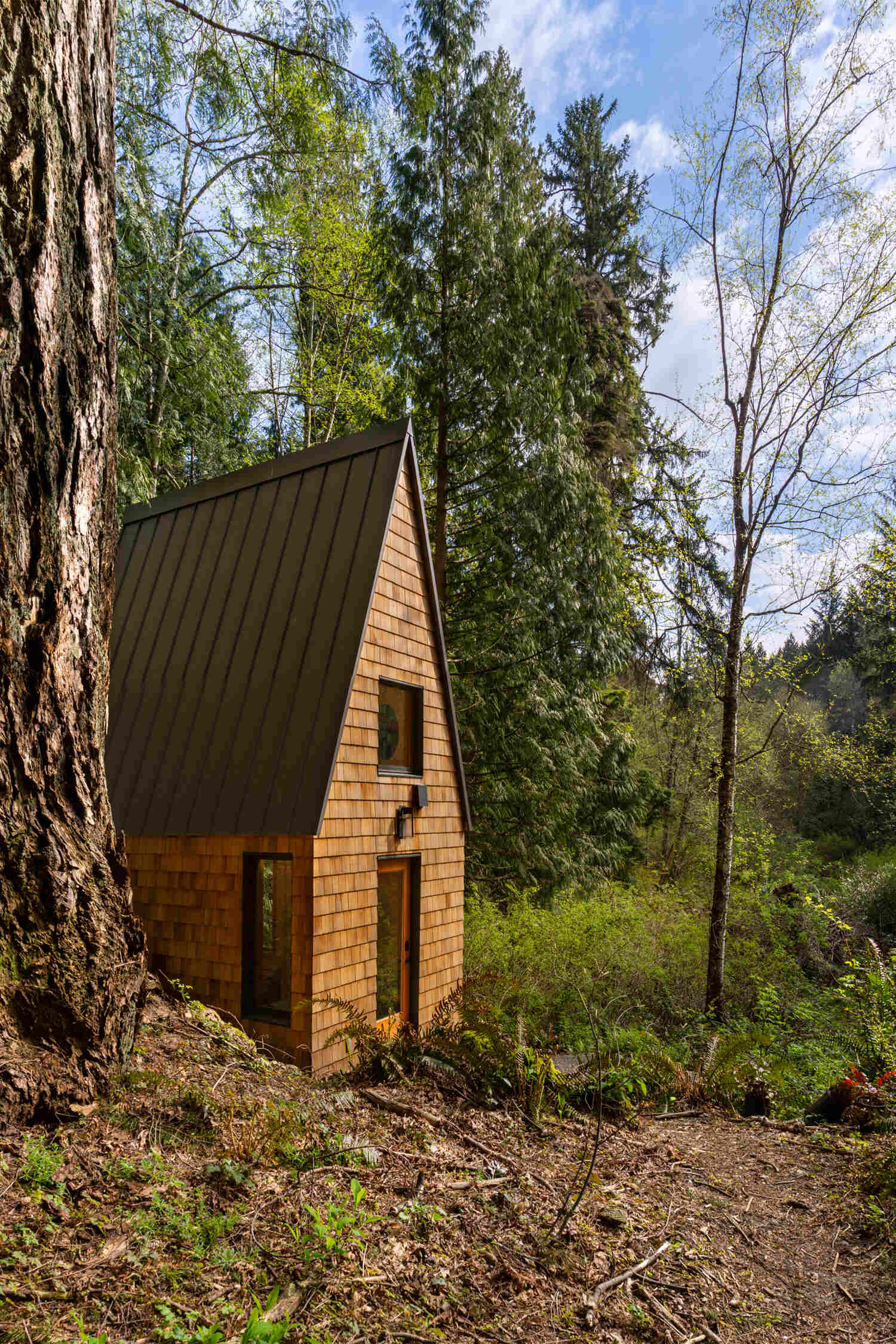 A small shingle-clad chapel.