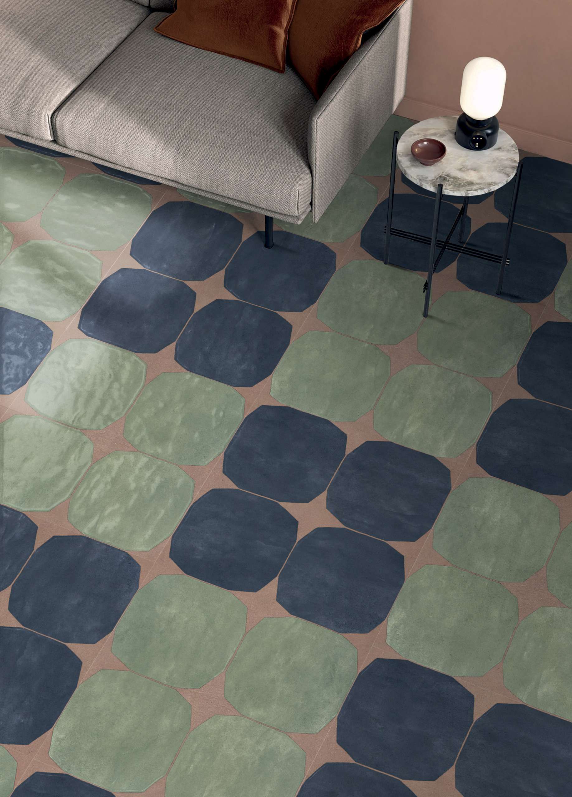 These organic tiles in green and blue create a rhythmic, high-impact floor moment. Perfect for adding depth and personality to a muted living space with a hint of vintage elegance.