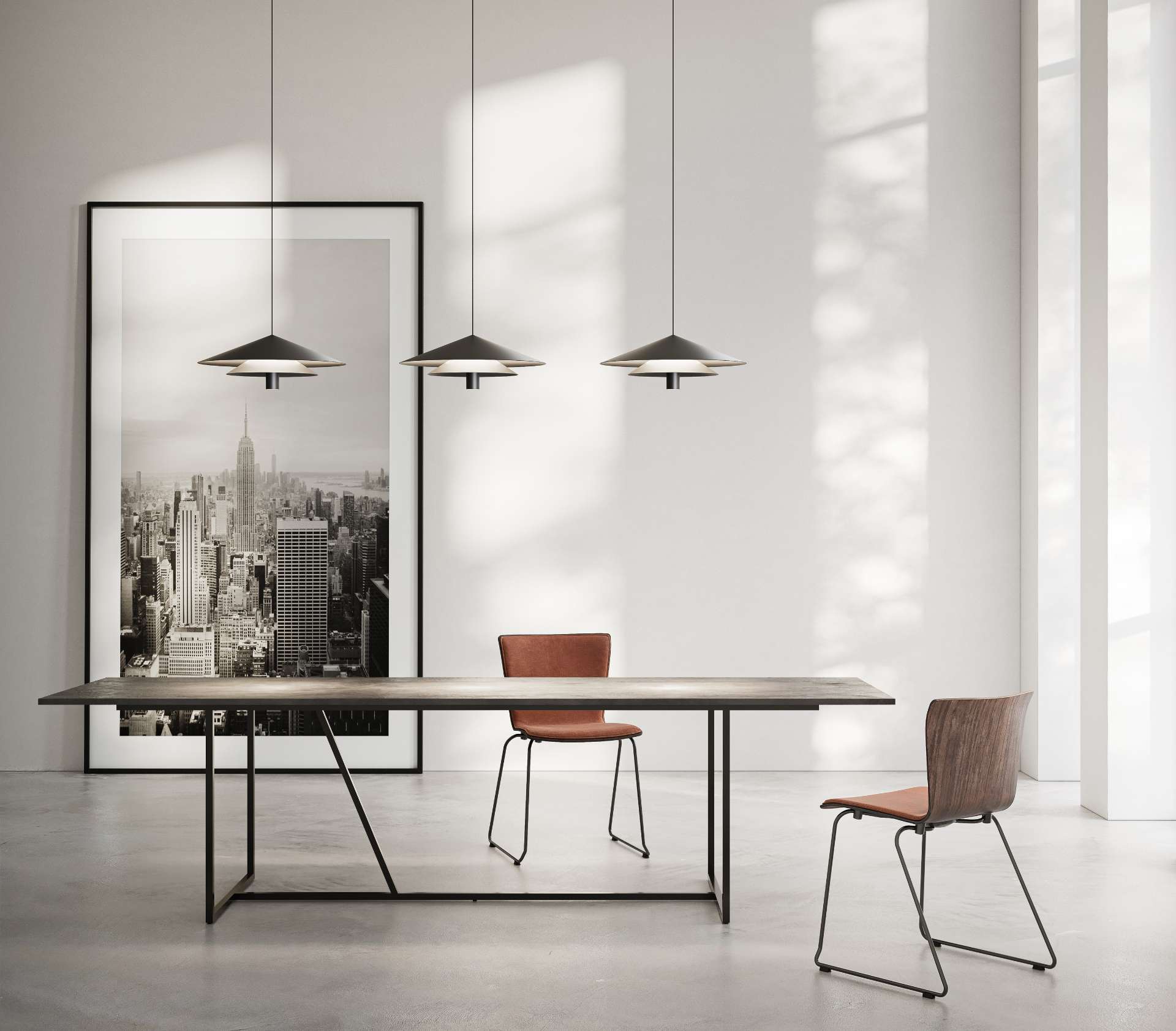 Create a warm, inviting dining experience with the Asso pendant light. Its sleek black form floats effortlessly above the table, blending elegance with ambiance. Ideal for both everyday meals and special occasions.