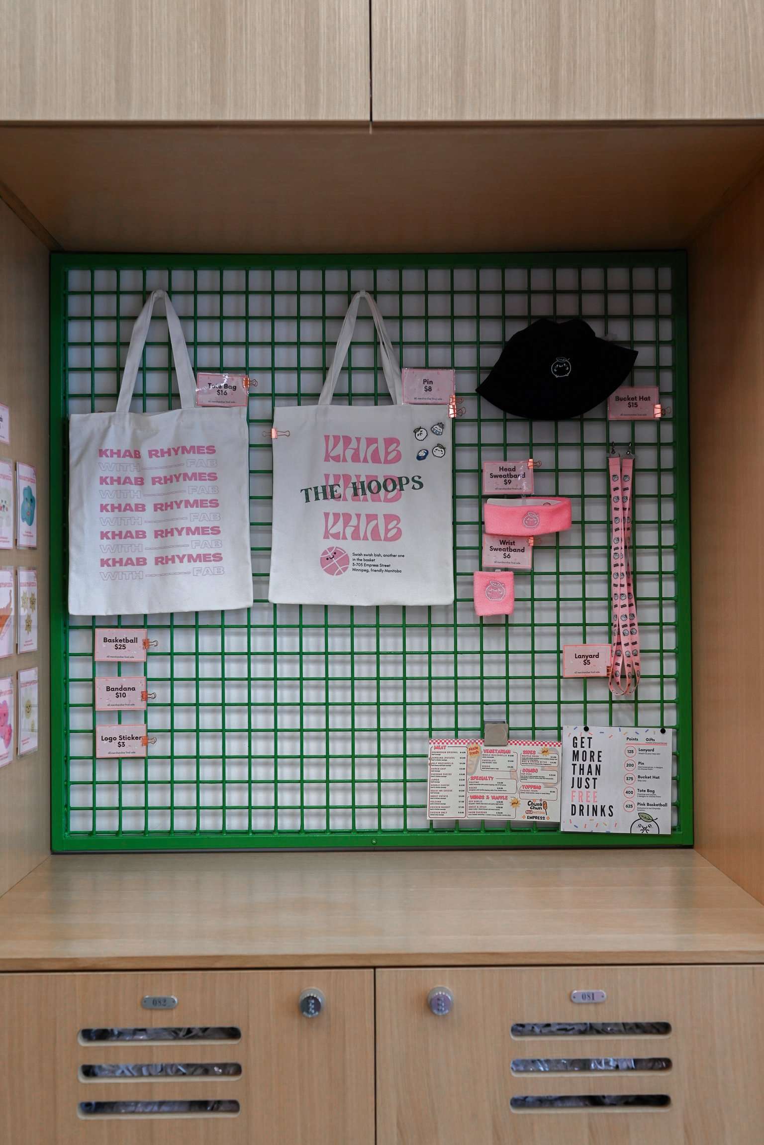 This clever locker-style wall brings a gym-inspired aesthetic to the bubble tea experience. With green accents, wood finishes and playful merch displays, it perfectly captures the fun-meets-functional vibe of this sporty, design-forward space.