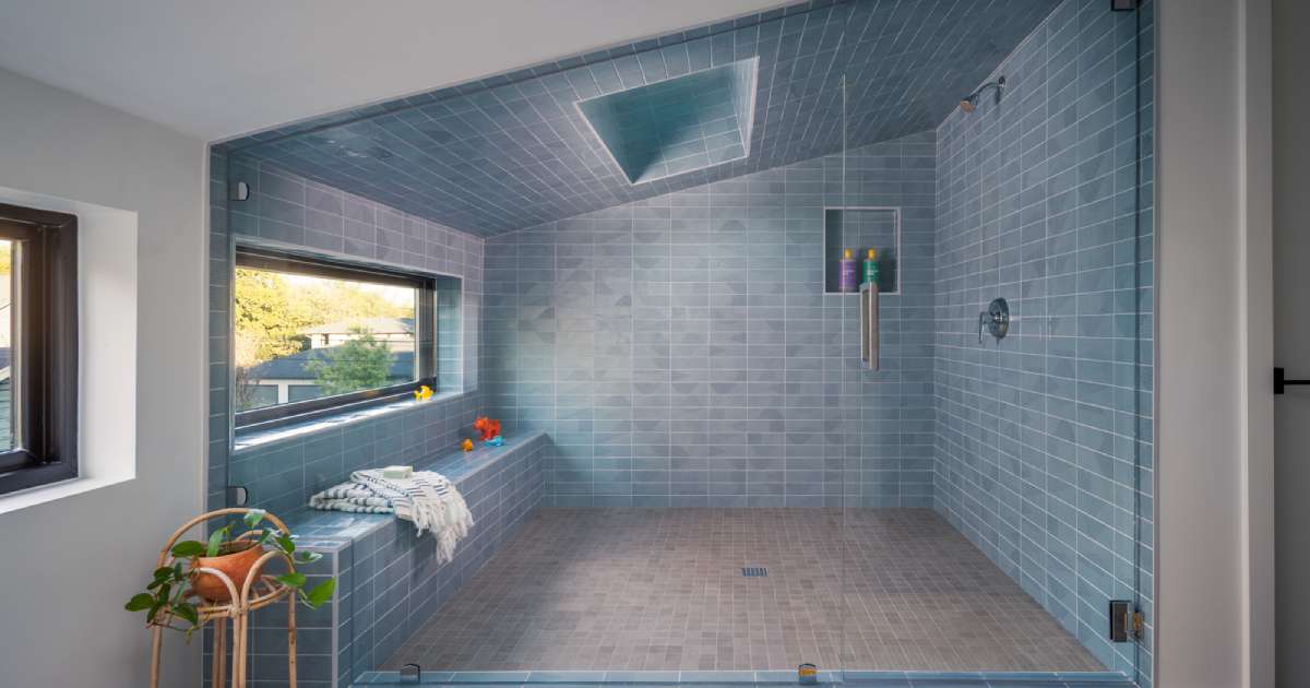 A Sky-Lit Blue-Tiled Shower Steals The Show Inside This Home