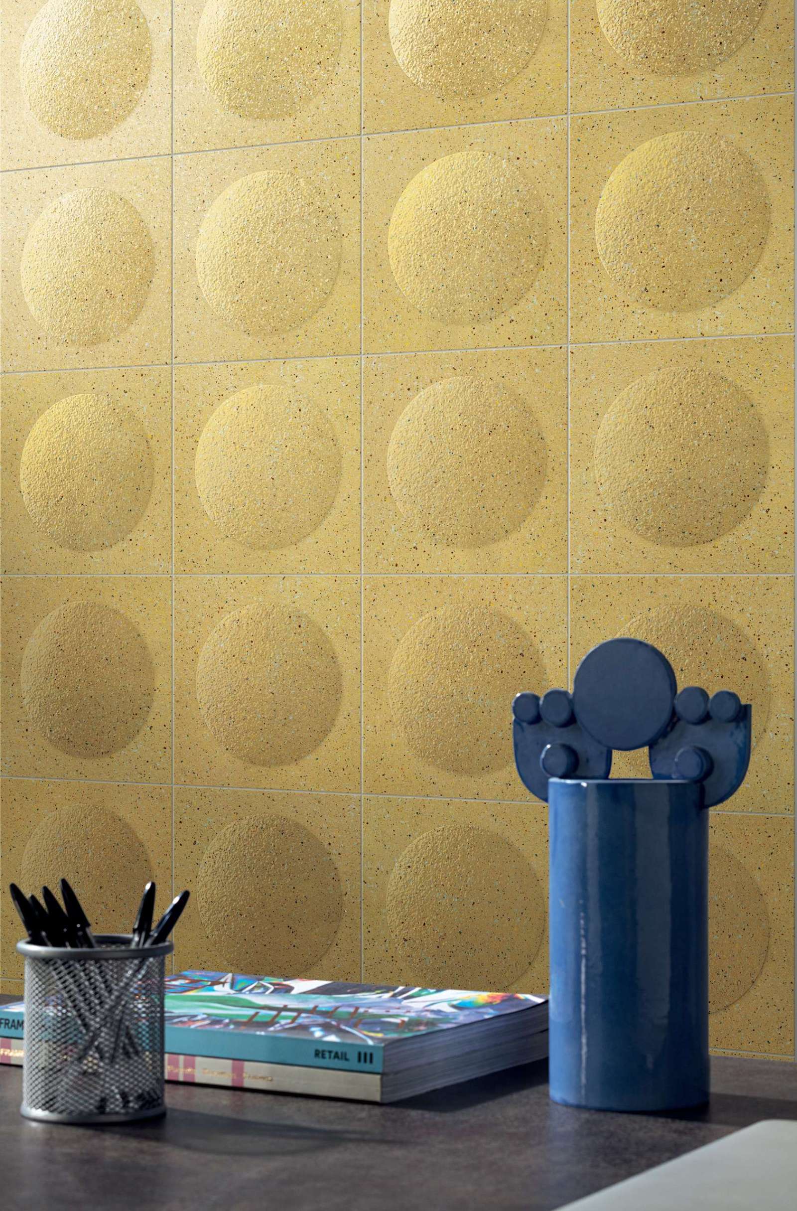 Bold and playful, this room uses yellow bubble tiles to create a statement wall that radiates optimism. The soft curves of the tiles give a retro pop-art vibe, perfect for a small powder room with personality.