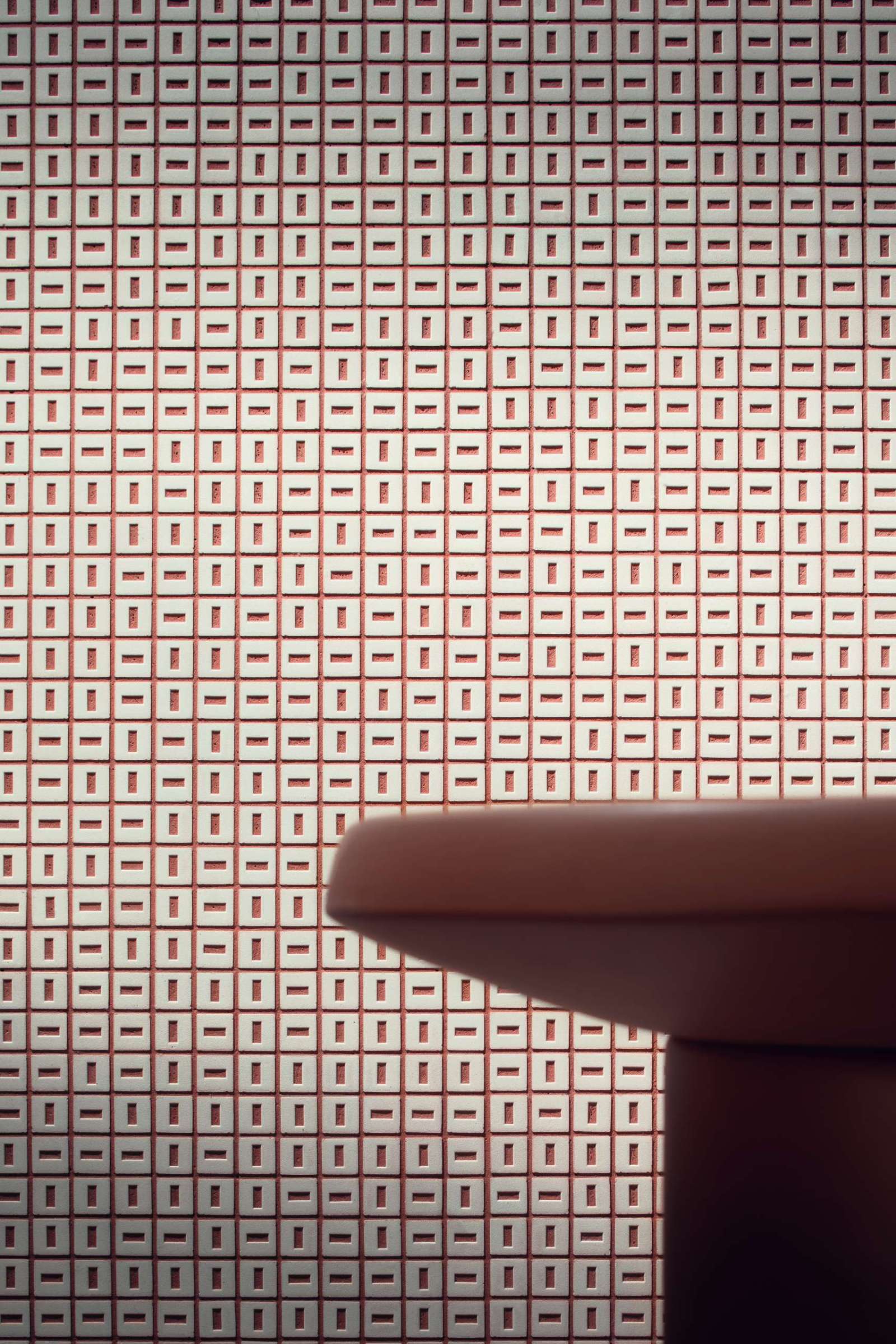 A striking play of repetition and contrast, this terracotta-and-white mosaic tile adds a graphic punch to contemporary interiors. Perfect for statement walls where texture meets precision.