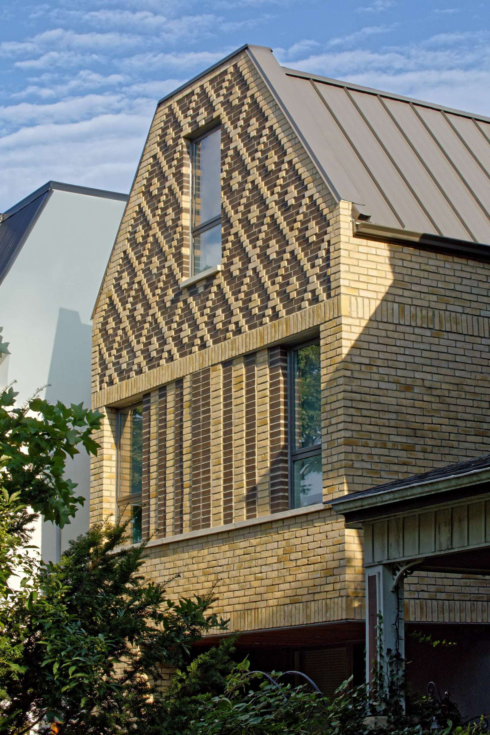 A contemporary home in Toronto, Canada, with diamond patterned brickwork on its facade.