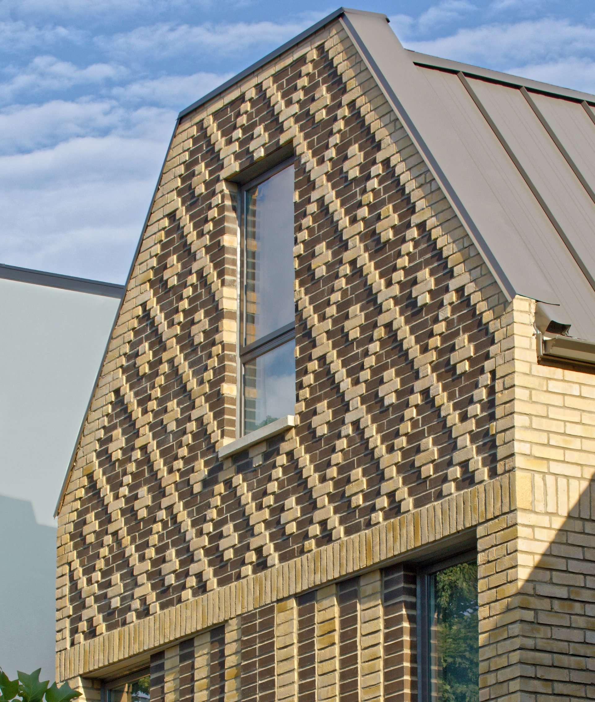 A contemporary home in Toronto, Canada, with diamond patterned brickwork on its facade.