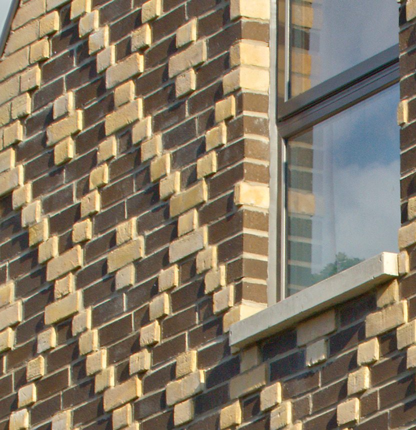 A contemporary home in Toronto, Canada, with diamond patterned brickwork on its facade.