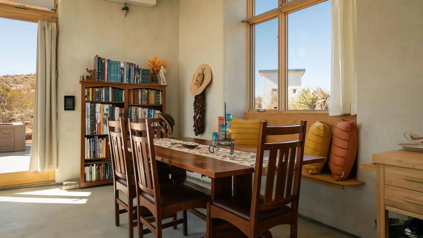 Stepping inside this small desert cabin, there are soft arcs and rounded transitions that echo the natural forms outside.