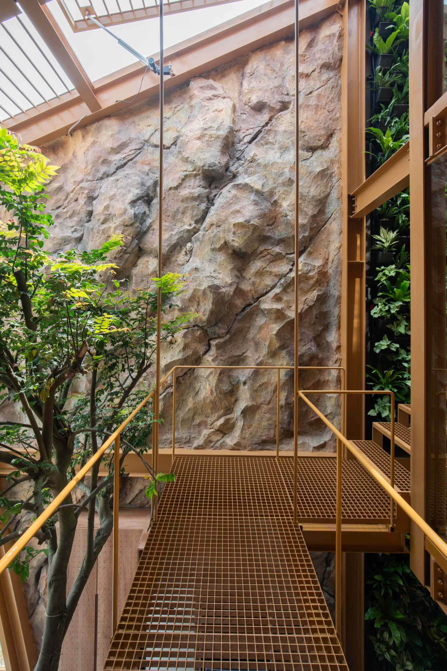 Suspended walkways framed in glass and steel weave through the home, connecting spaces while adding a sense of lightness and openness to the interior.
