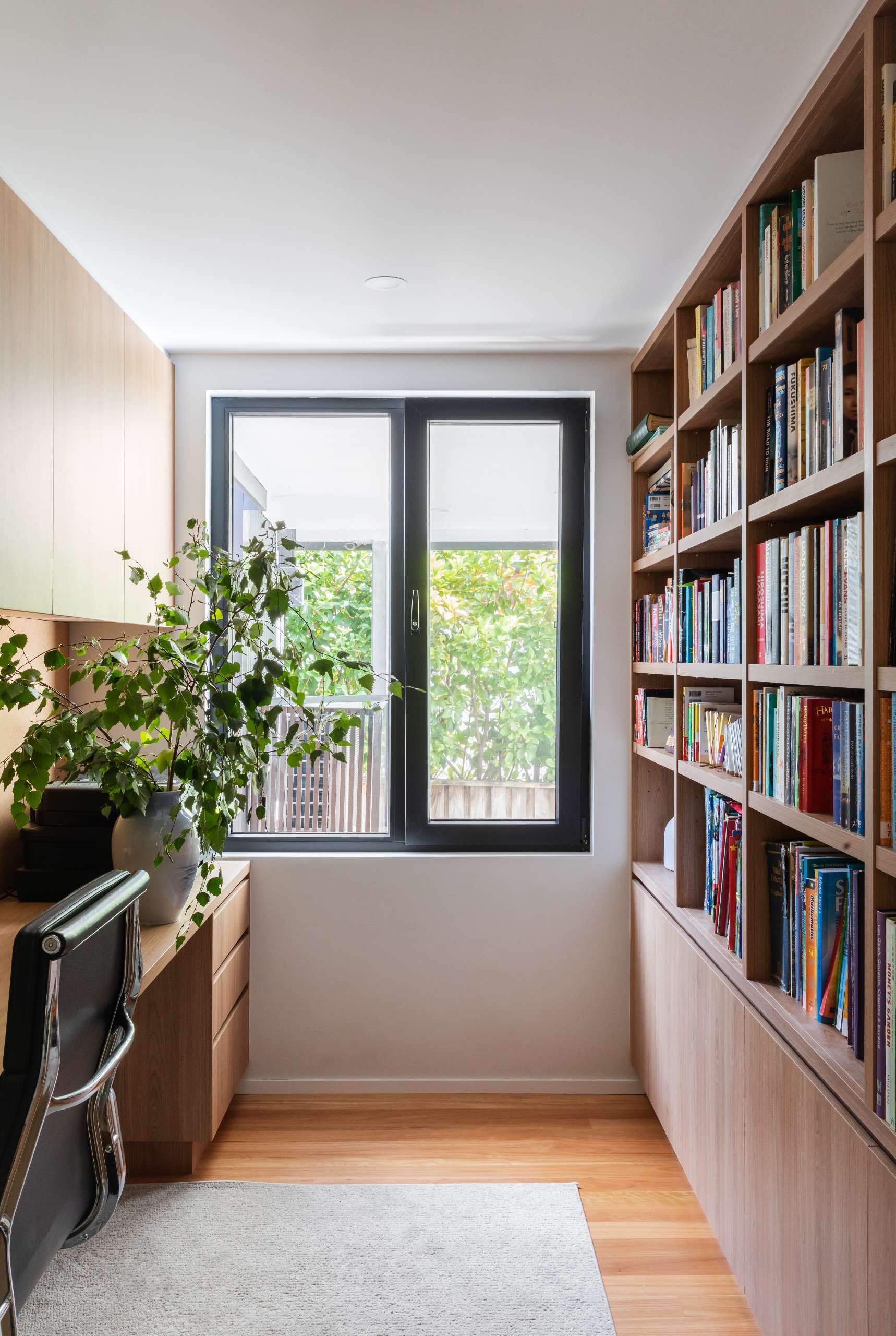 A dedicated office space offers a quiet retreat for focused work. While compact, the room is designed for calm productivity, continuing the broader themes of minimalism and visual clarity.