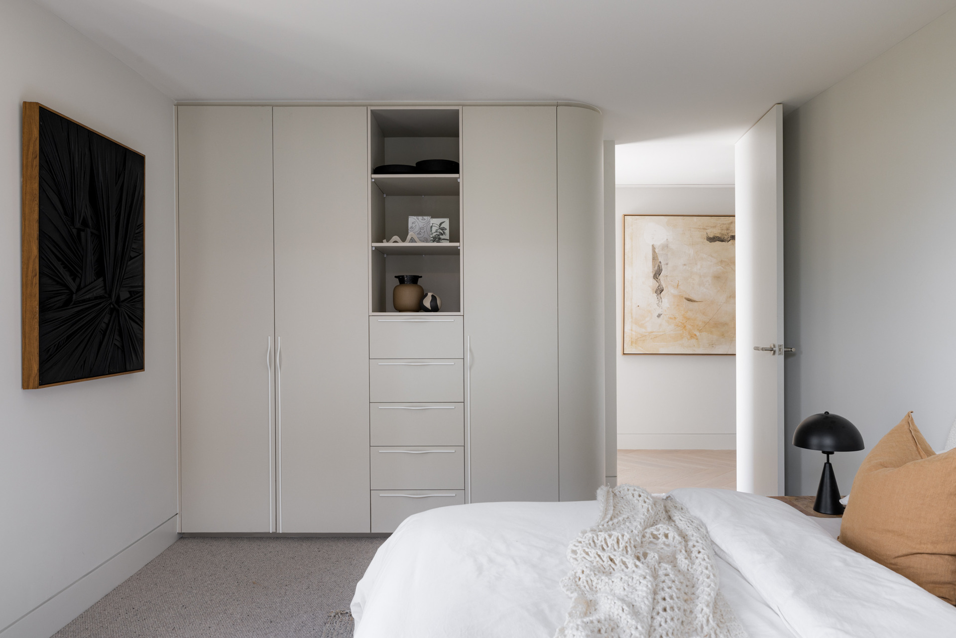 Modern bedroom with built-in closet.