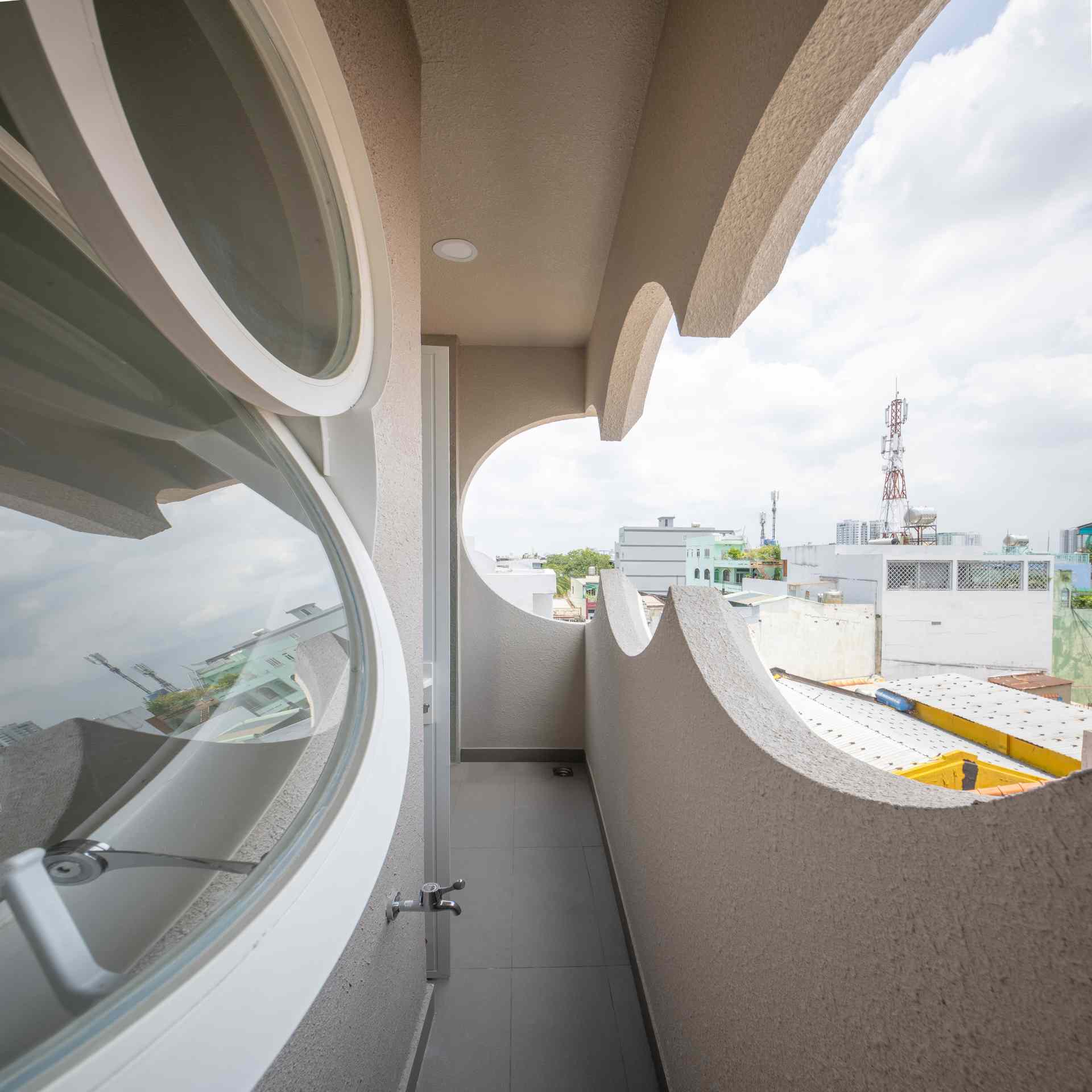 A modern building with cloud-shaped openings.