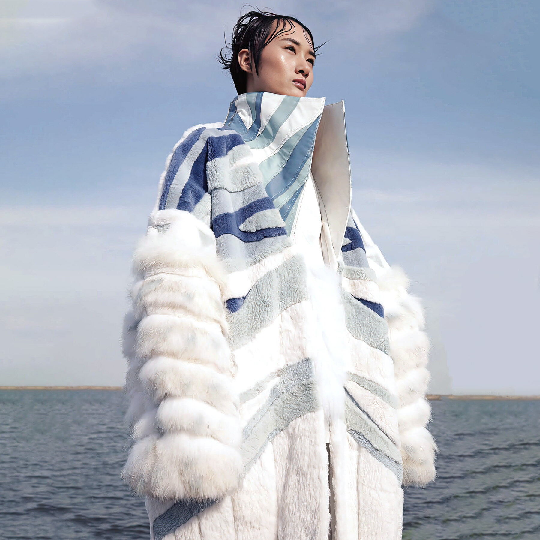 Inspired by the melting and formation cycles of glaciers, this collection symbolizes their breathing life-force. The collection is entirely made from biodegradable polyester fiber synthetic leather and faux fur. The fabric is crafted with materials that mimic the intricate textures of melting glacier surfaces, with the patterns being manually pieced together to replicate the glacier's unique forms