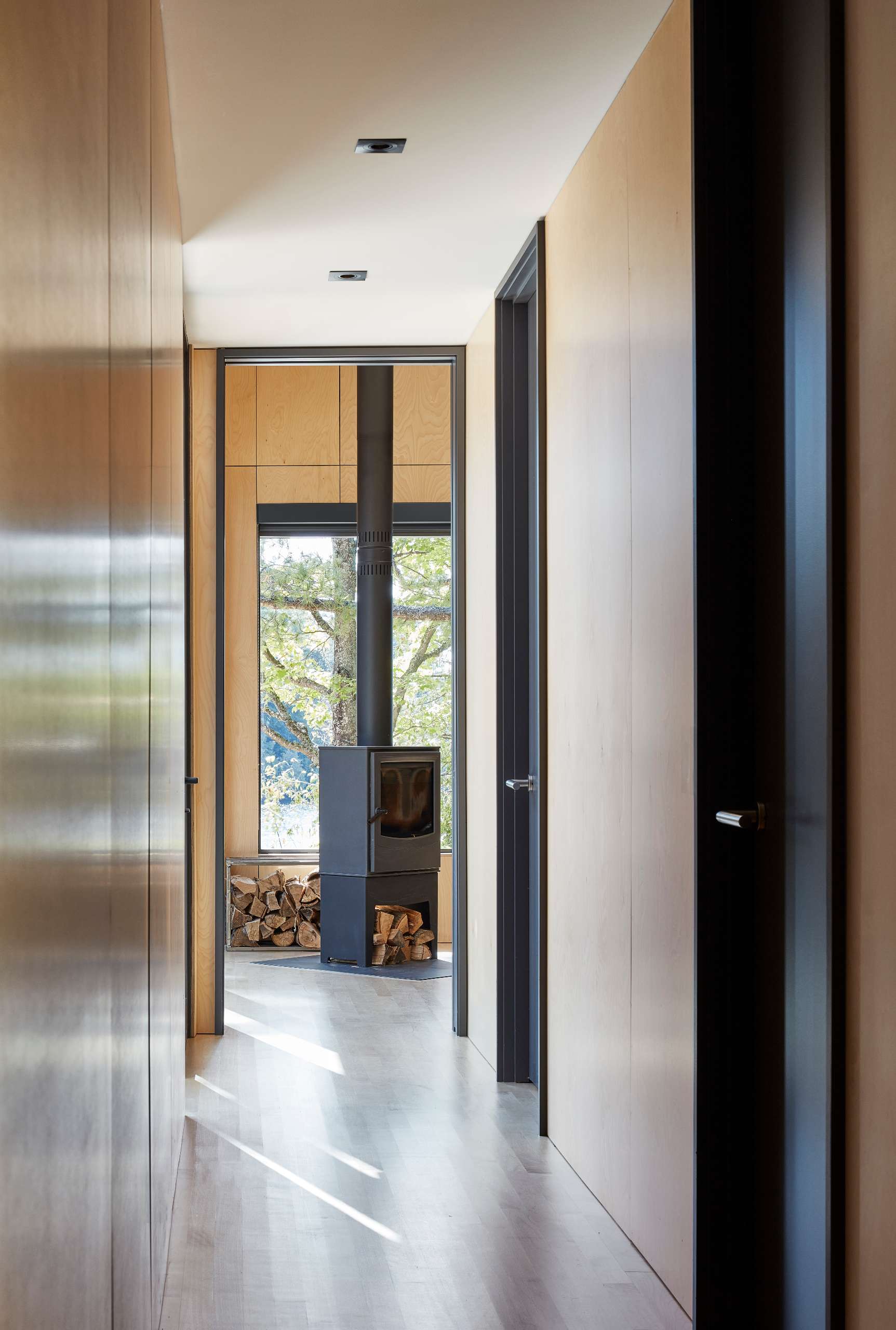 A modern cottage with wood floors and walls.