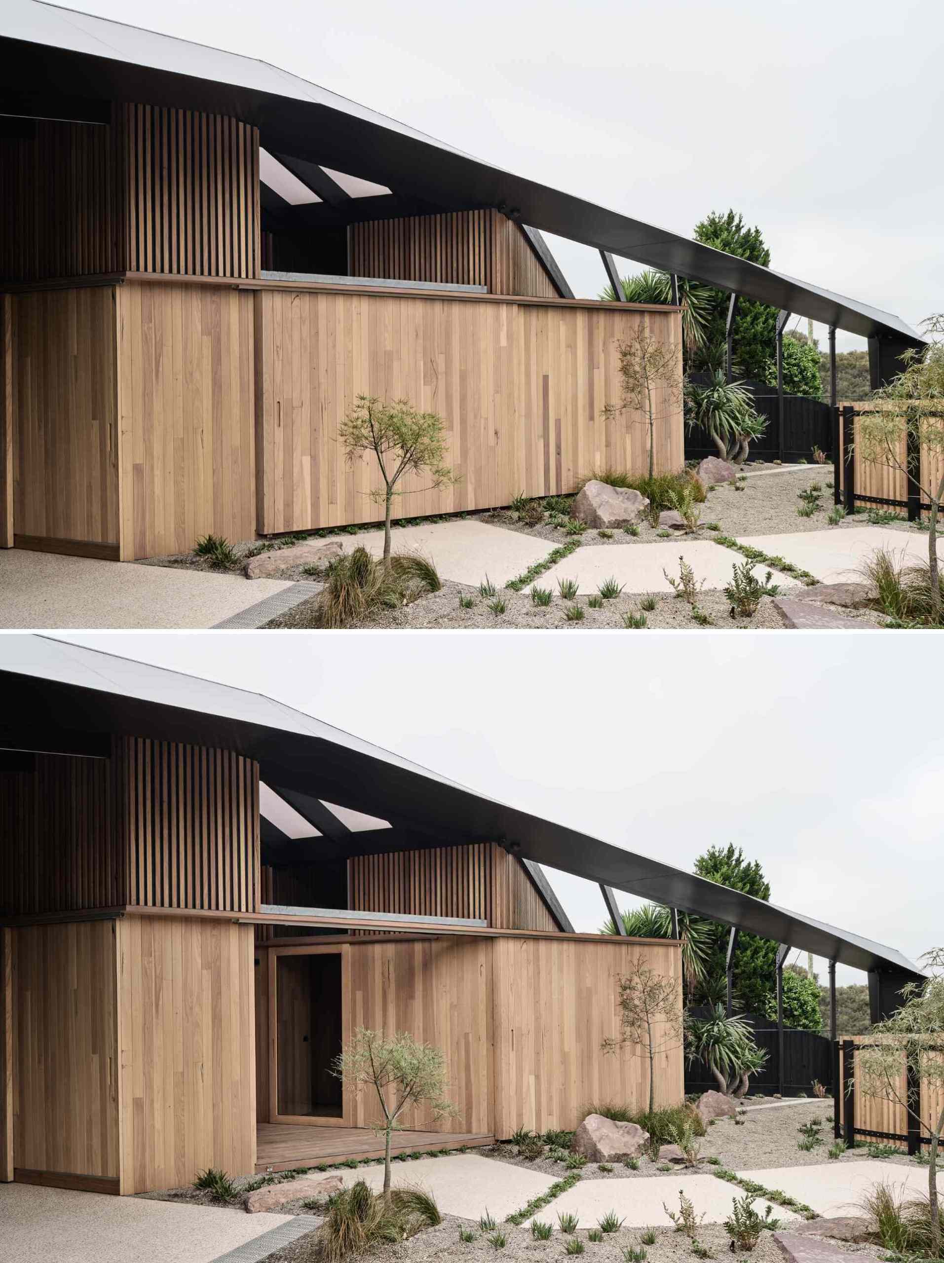 A concealed front door blends seamlessly into the timber cladding, opening to reveal a warm, wood-lined entry. Subtle landscaping guides the way, creating a calm, understated welcome that’s all about quiet impact.