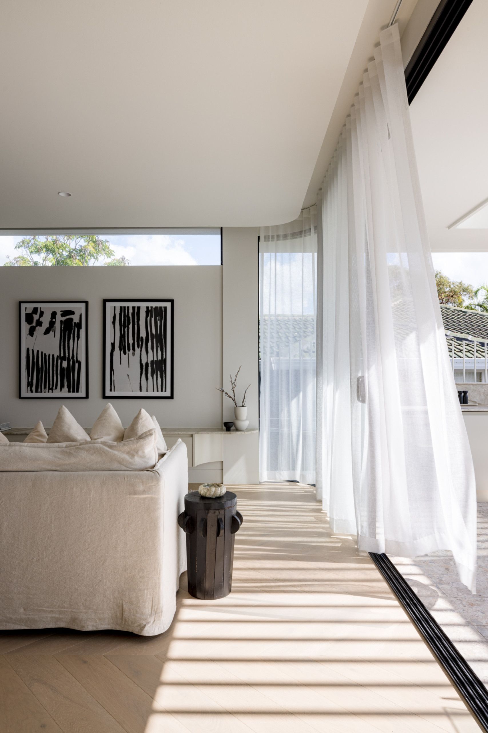 The interior of home is light and airy, with the materials providing warm and elegant tones with the use of oak floors, wool carpet, quartzite, and limestone.