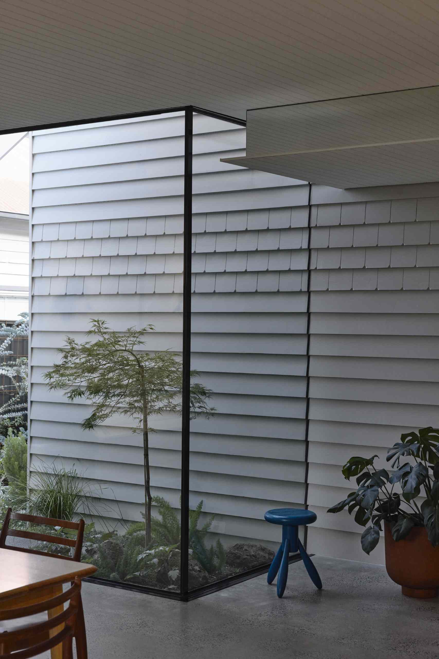 To define the original part of the house in respect to the addition, the external materiality of painted weatherboards is continued through internally.