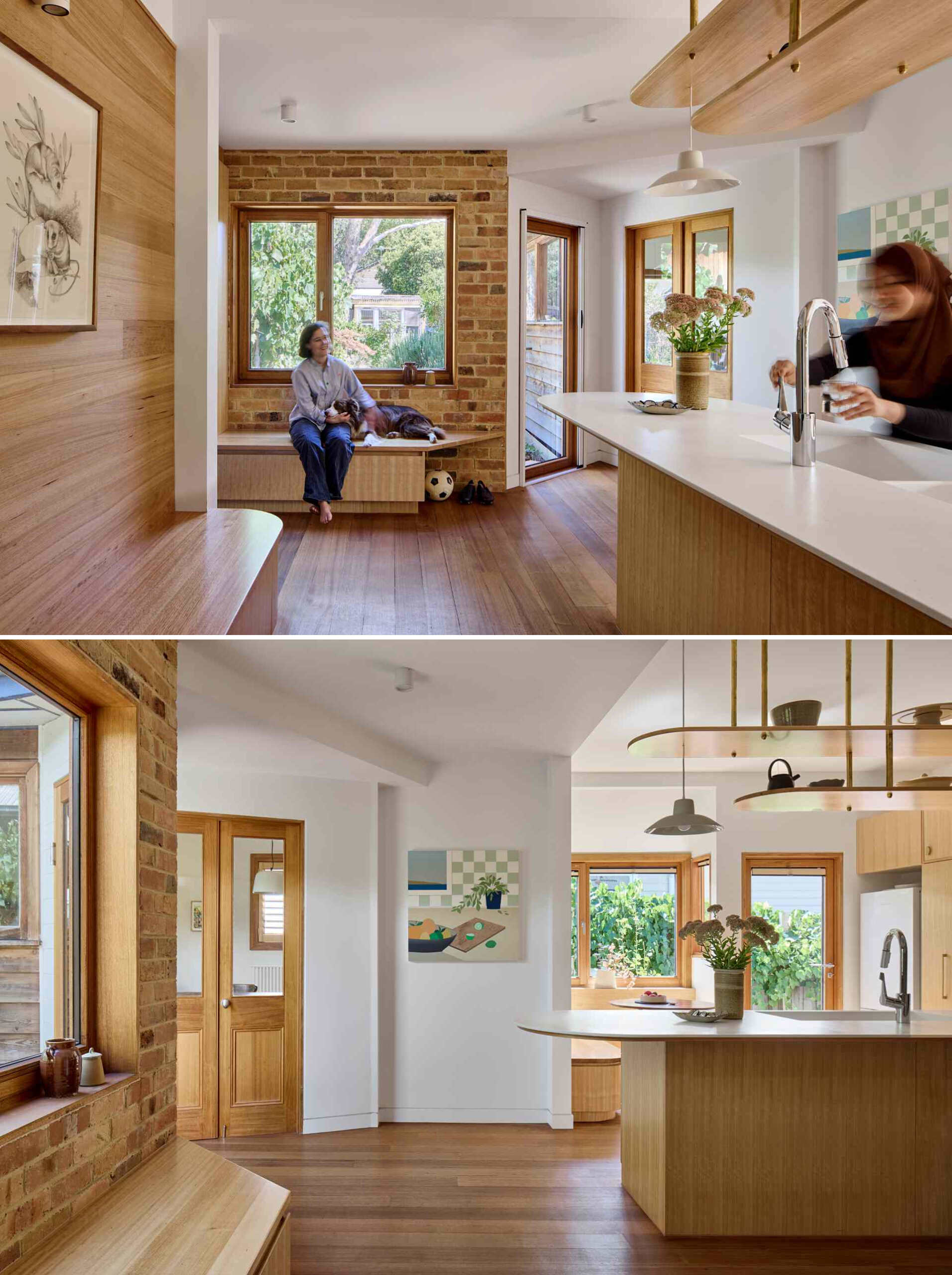 A contemporary kitchen with wood cabinets and white countertops, also includes a variety of seating options in the form of built-in benches.