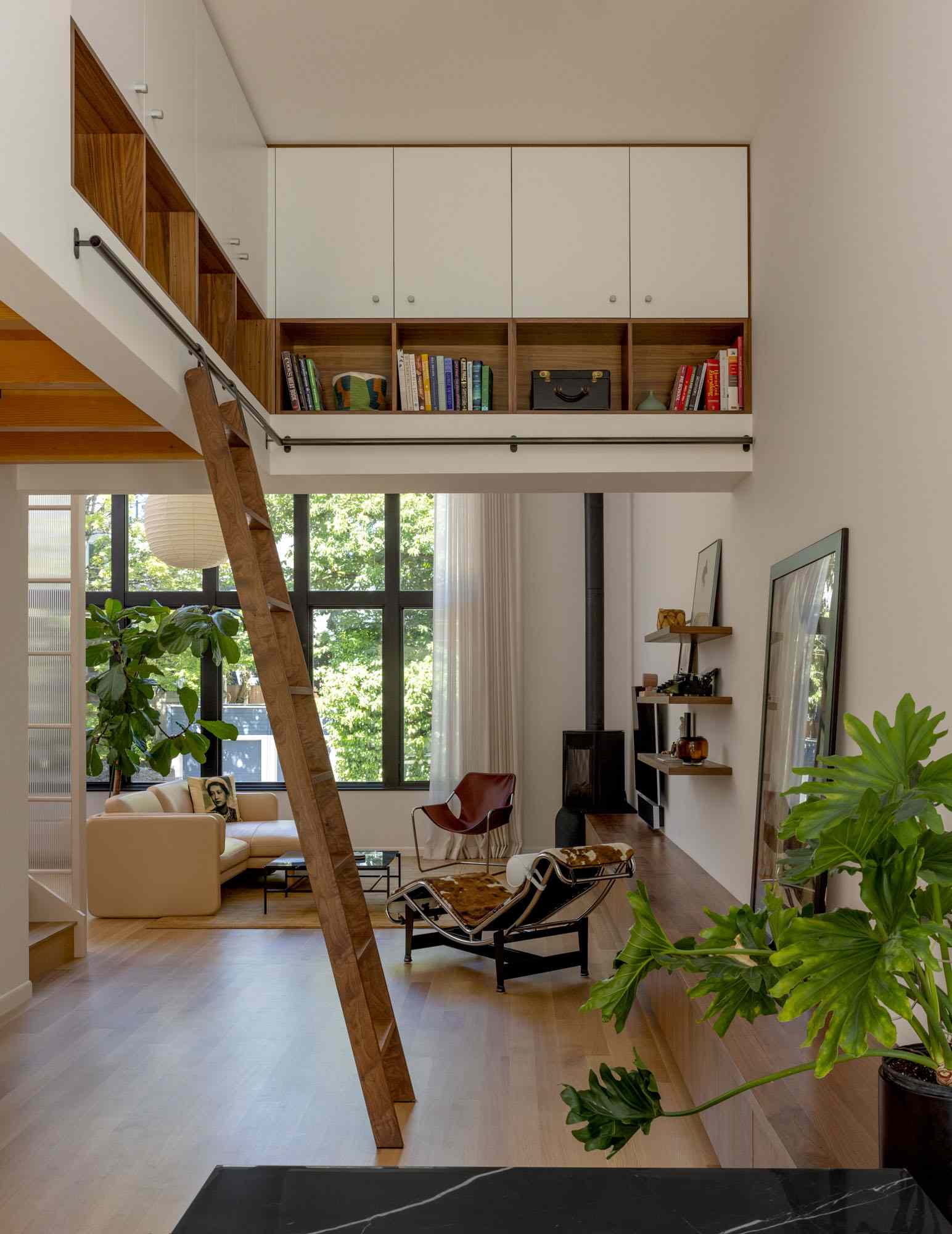 Added storage has been included to make the most of the high ceiling, with a ladder providing easy access.