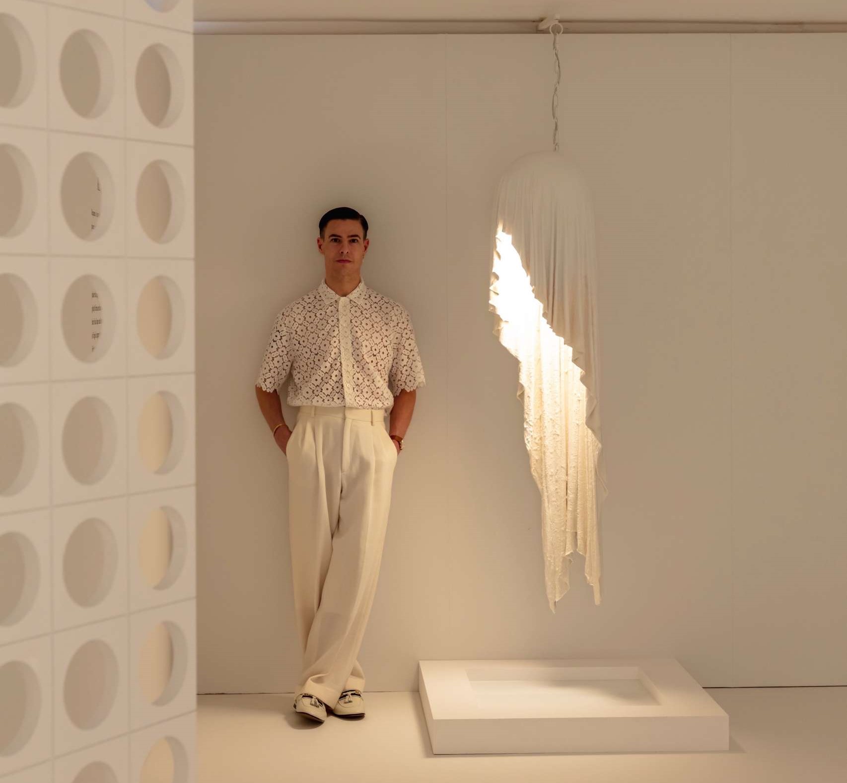 The Requiem Light Collection is handcrafted in plaster using a unique sculpting technique, capturing the fluidity of draped fabric in a striking form.