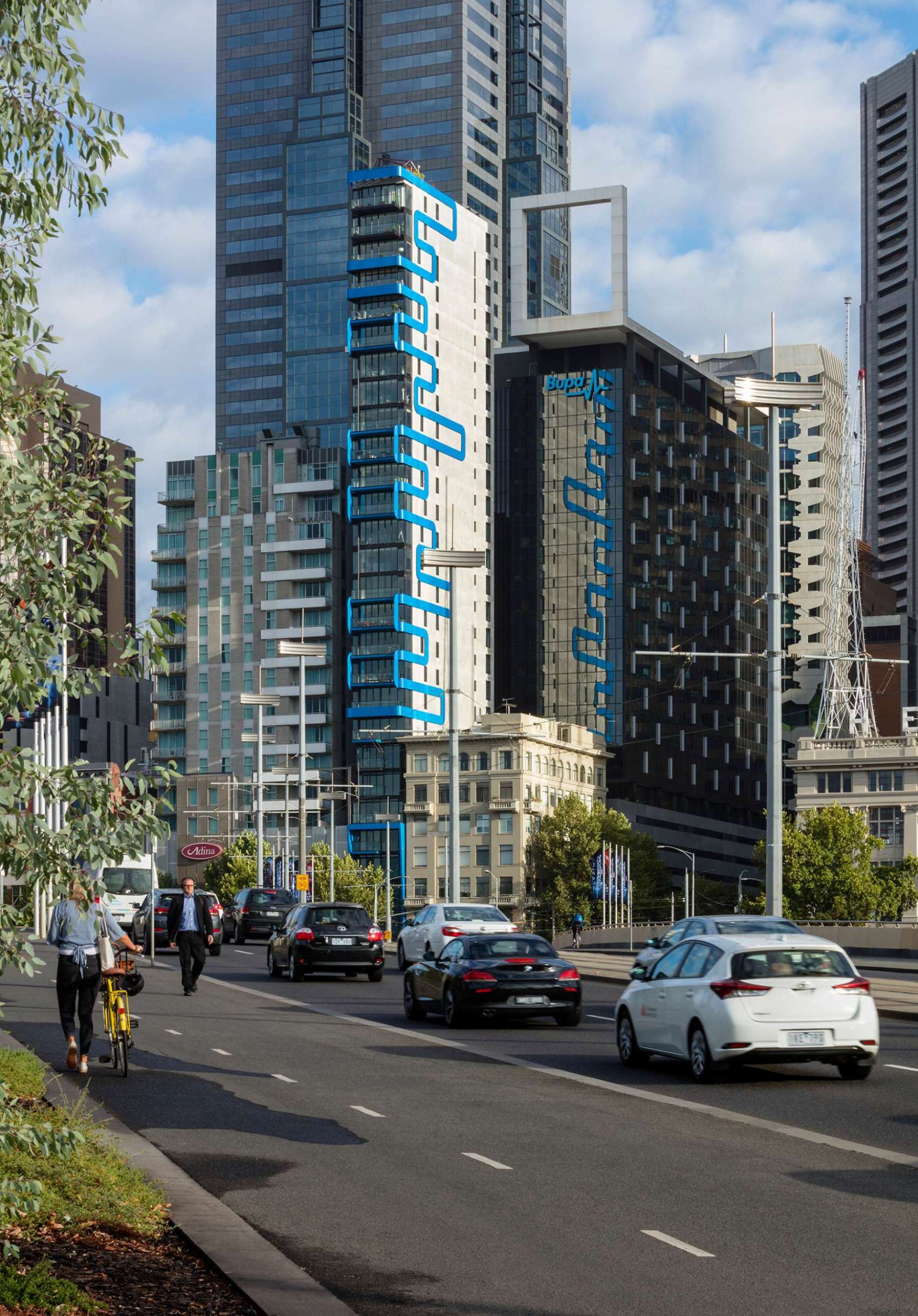 A sculptural steel arbour frames the Phoenix Rooftop garden in central Melbourne, casting dynamic shadows across a mosaic-tiled courtyard. The space blends lush planting, custom tiling, and defined seating zones to create a liveable garden 30 storeys above the city. This rooftop retreat shows how structure and greenery can work together in high-rise outdoor design.