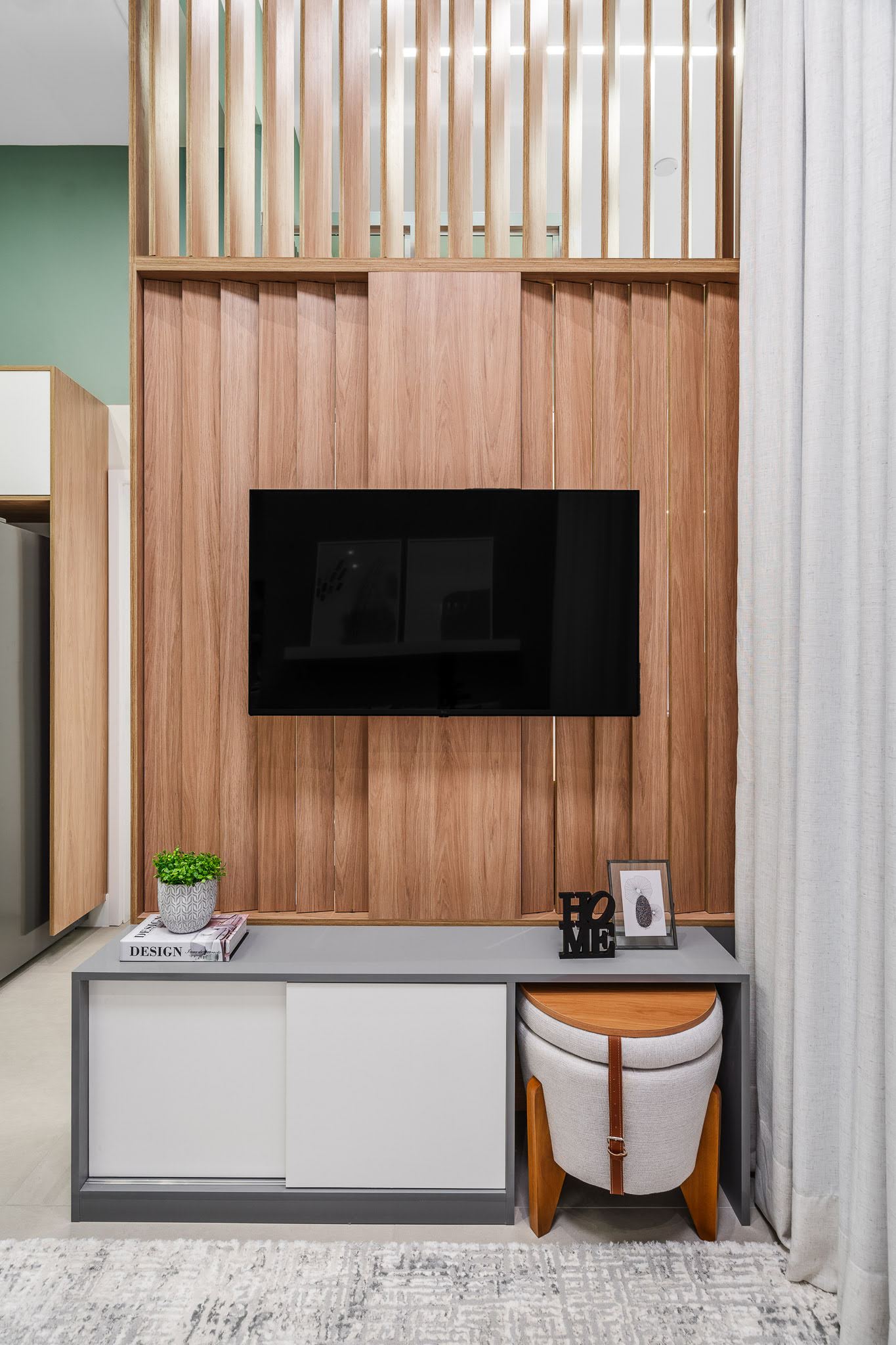 This divider between the stairs and living room, has moveable wood fins, allowing the light to be closed off when needed.