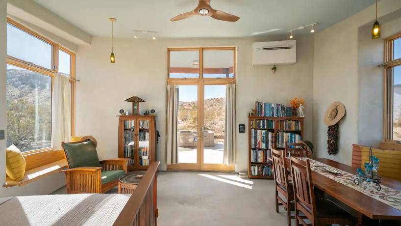 Stepping inside this small desert cabin, there are soft arcs and rounded transitions that echo the natural forms outside.