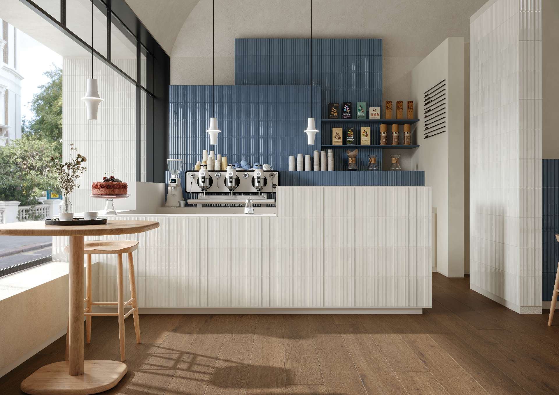 A fresh take on café design with vertical tile cladding in creamy white and soft slate blue, creating a clean, inviting space that balances modern minimalism with warm natural textures.
