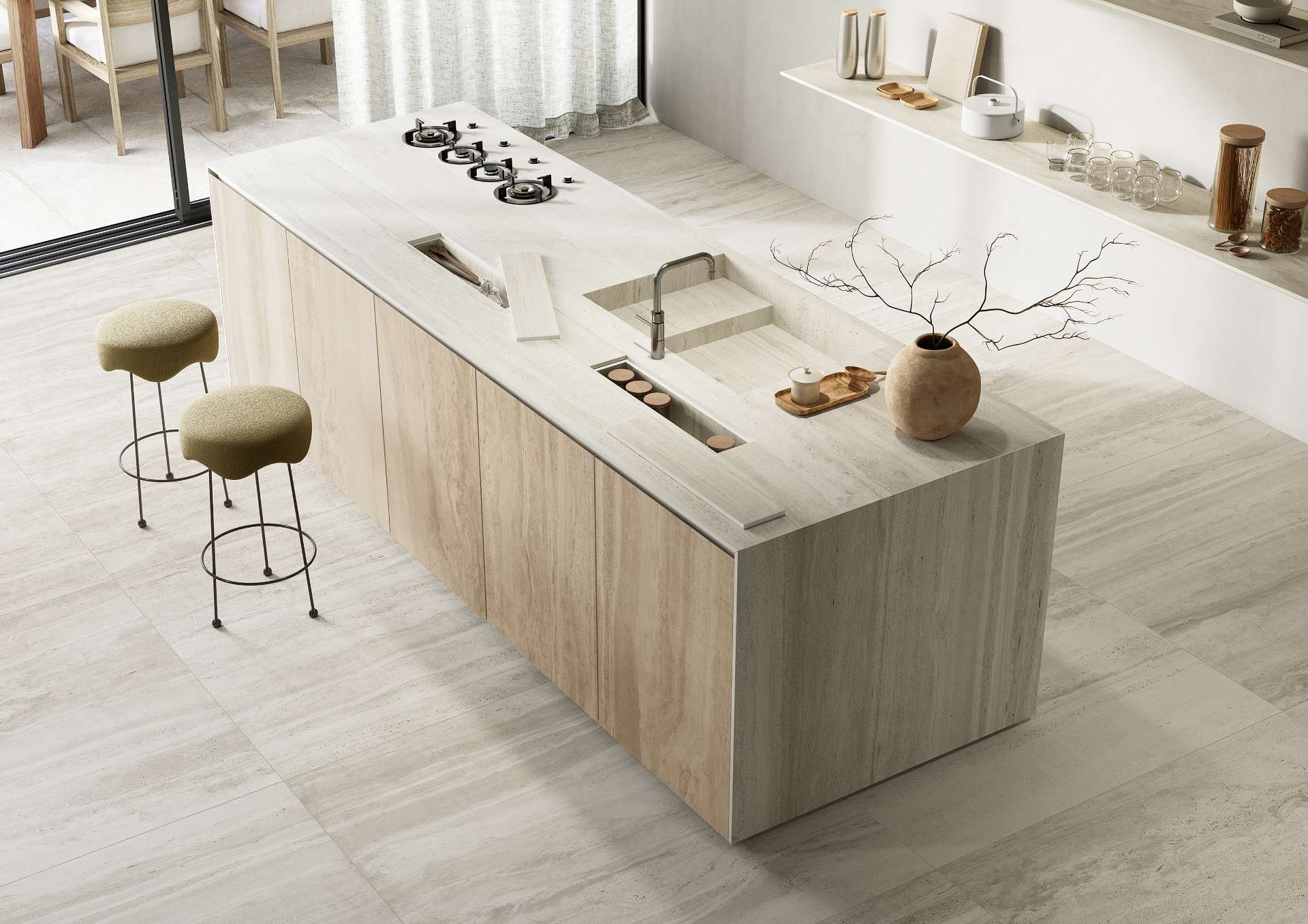 A serene kitchen island wrapped in travertine-look tile brings organic texture and calm minimalism into focus, blending functionality with sculptural beauty in a soft neutral palette.