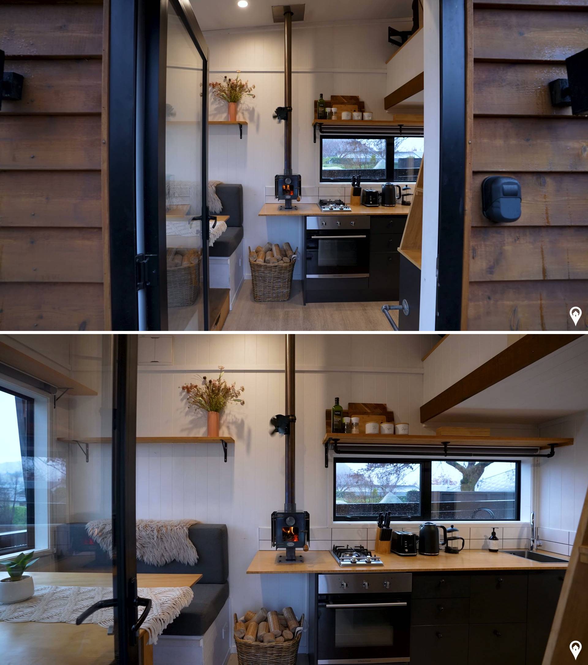 The interior of this tiny house has a clean, minimalist layout. Stepping inside, there's a dining area that includes built-in banquette seating. A picture window offers views of the surrounding mountains.
