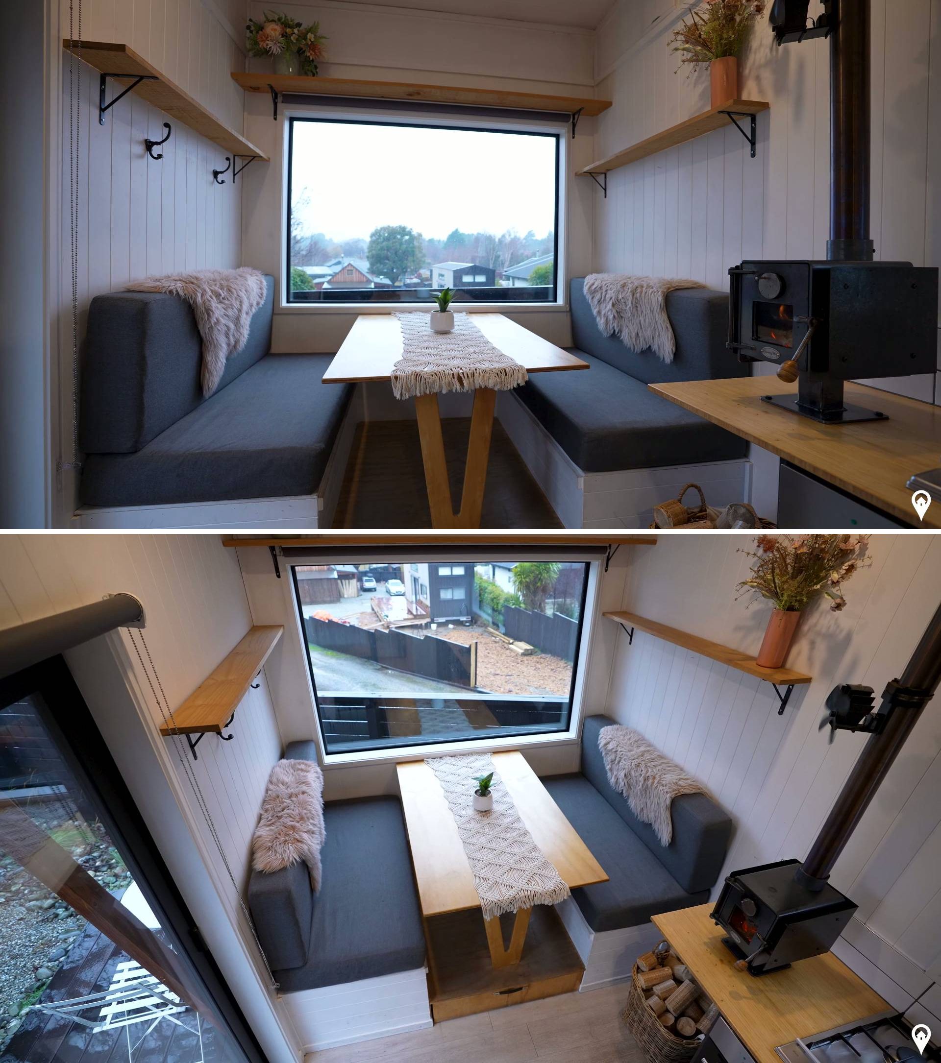 The interior of this tiny house has a clean, minimalist layout. Stepping inside, there's a dining area that includes built-in banquette seating. A picture window offers views of the surrounding mountains.