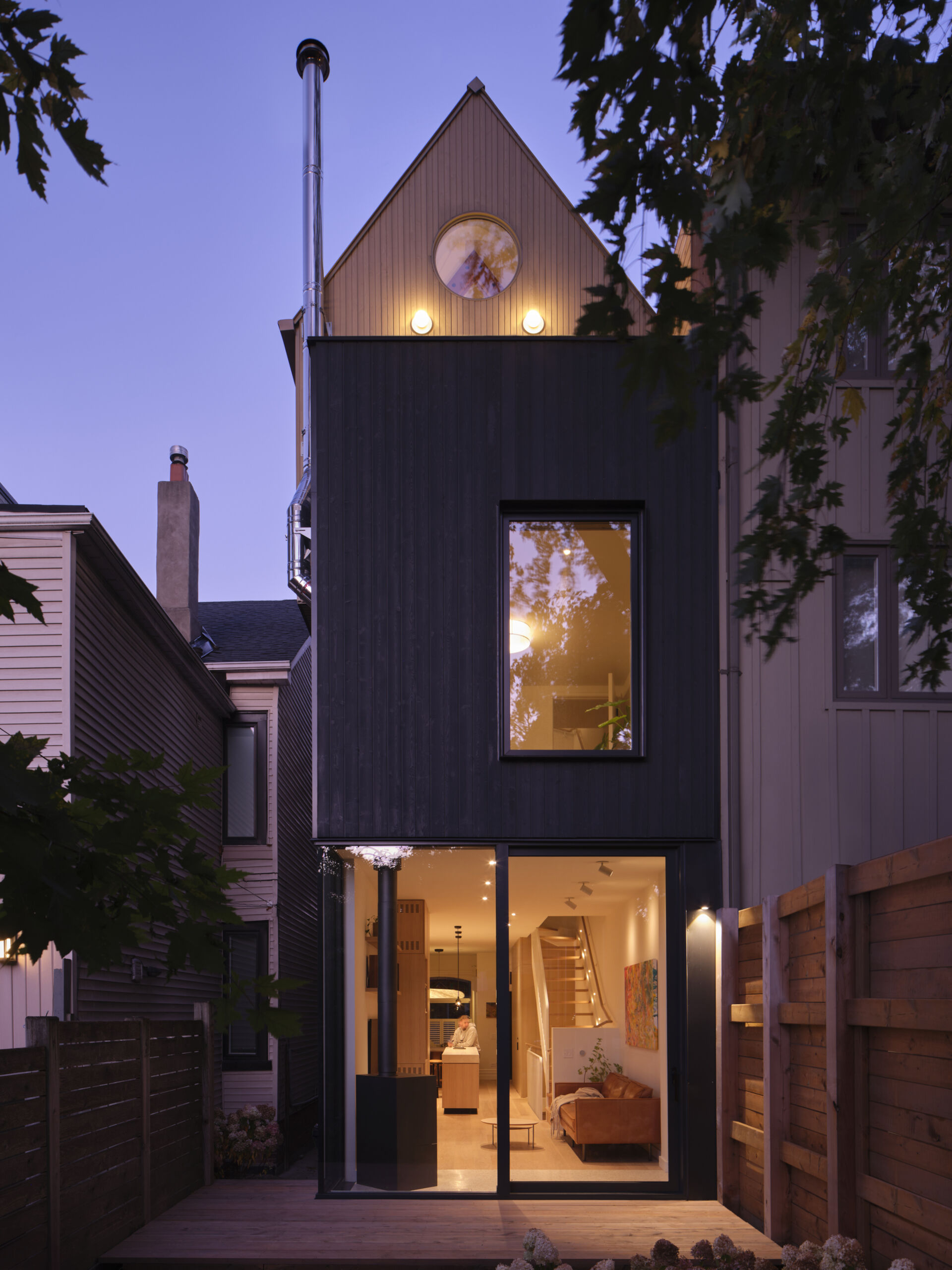 Discover a modern family home in Toronto that beautifully blends Victorian charm with a striking A-frame addition and warm natural materials.