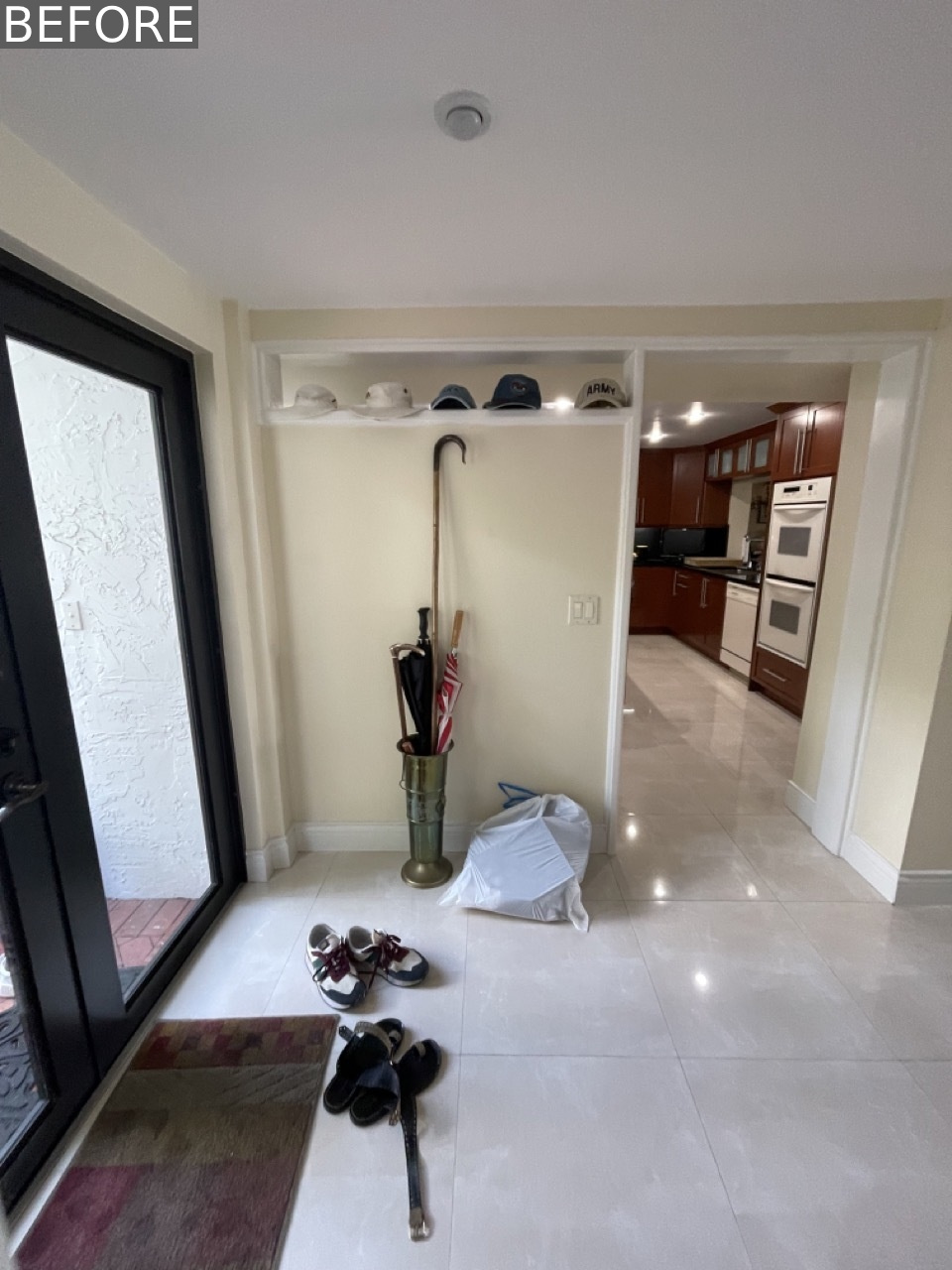 Before the renovation, the entryway lacked definition and offered no dedicated storage, just a blank transitional space that didn’t set the tone for the home.
