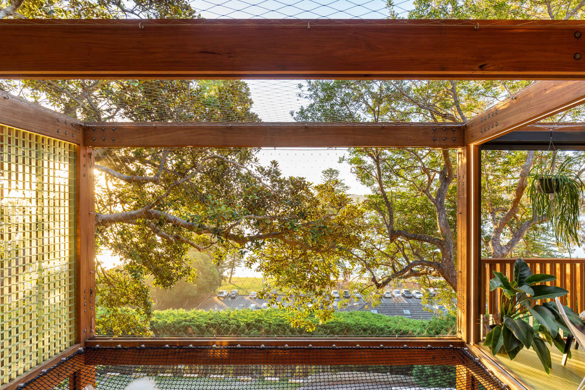 A cargo net hammock bay lets you lie back and float among the leaves, suspended in the treetops of this tranquil Palm Beach escape.