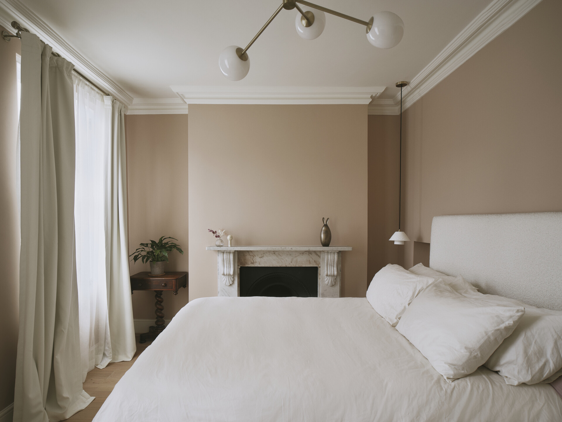 This original bedrooms has been thoughtfully refreshed, balancing historical charm with a modern sensibility. Period features such as high ceilings and tall windows remain intact, while new elements like niches, closets, and custom joinery introduce warmth and cohesion.