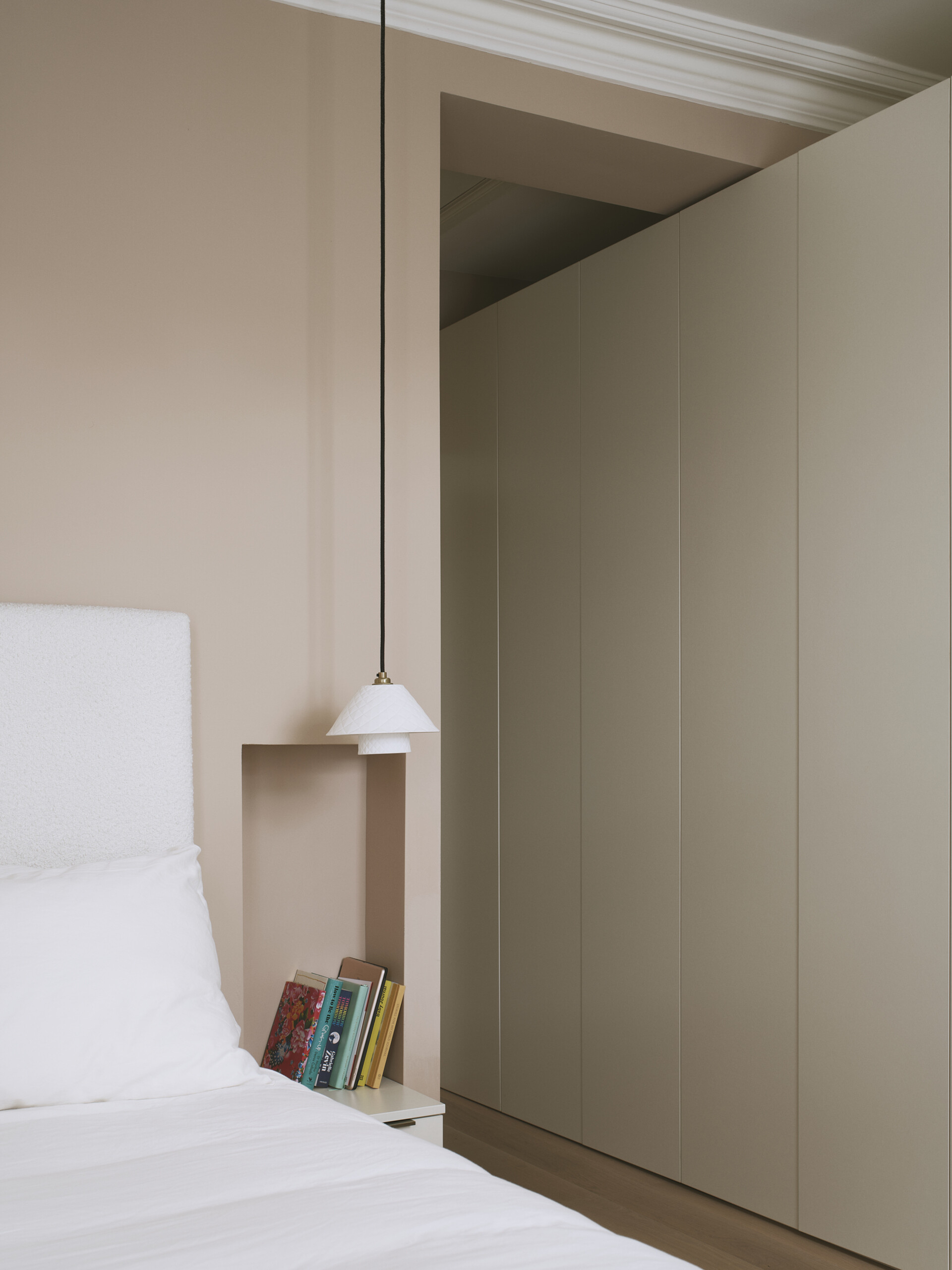 This original bedrooms has been thoughtfully refreshed, balancing historical charm with a modern sensibility. Period features such as high ceilings and tall windows remain intact, while new elements like niches, closets, and custom joinery introduce warmth and cohesion.