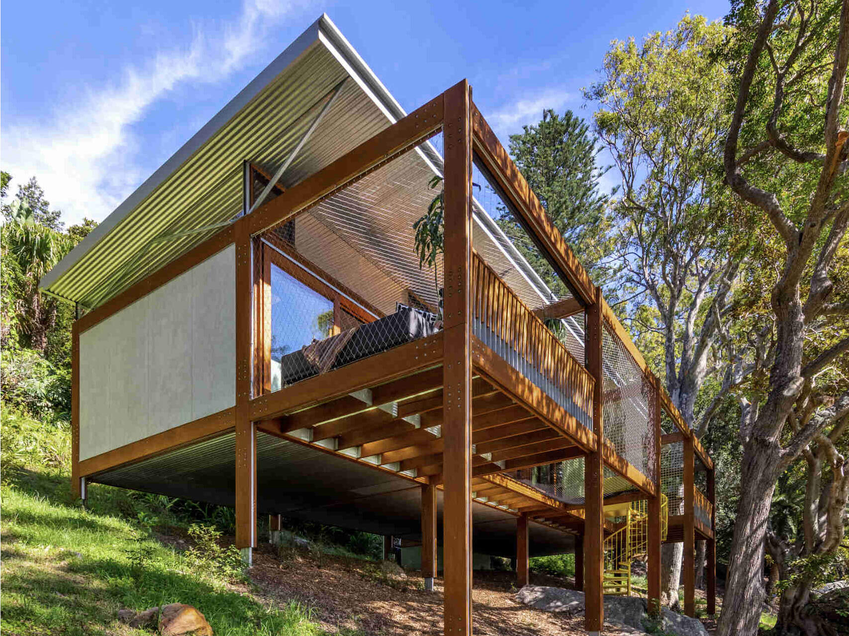 A timber-framed bushland retreat that feels both grounded and elevated, this modest home was assembled like a Meccano set to sit gently among the trees.