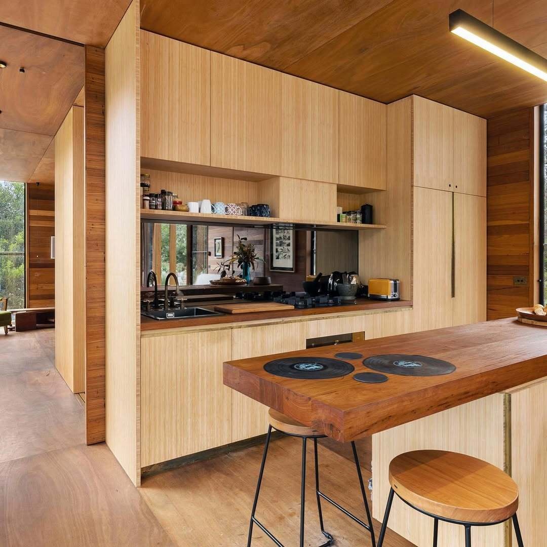 A modern kitchen with bamboo cabinets.