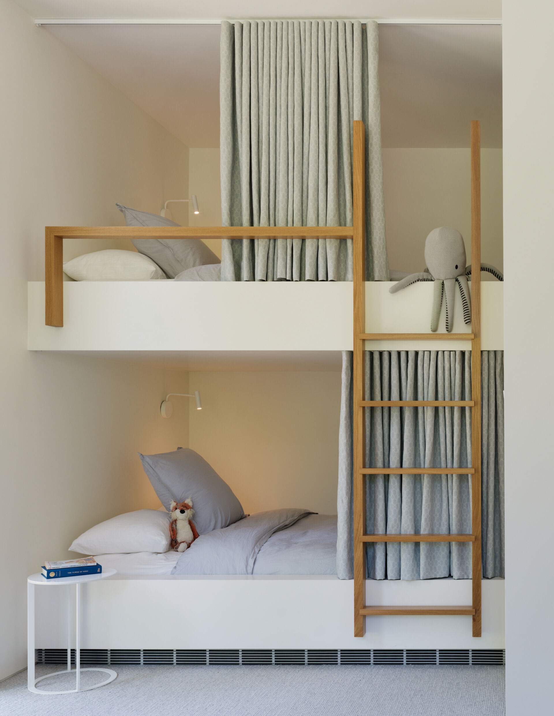 The guest suite includes thoughtfully designed built-in bunk beds fitted with queen-sized mattresses, offering both flexibility and comfort. This area is made with guests and growing teens in mind, a playful but practical space that feels casual without being cramped.