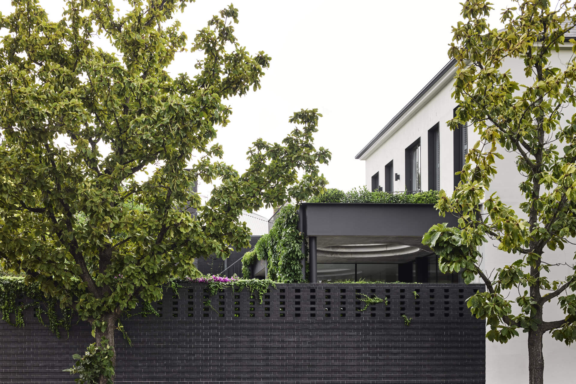 This new extension at the rear of the home is intentionally modest. But what it lacks in size, it makes up for in refinement. Using a palette of brick and concrete, the addition subtly distinguishes itself from the original house while maintaining a harmonious relationship. It’s a respectful nod to the past without replicating it.