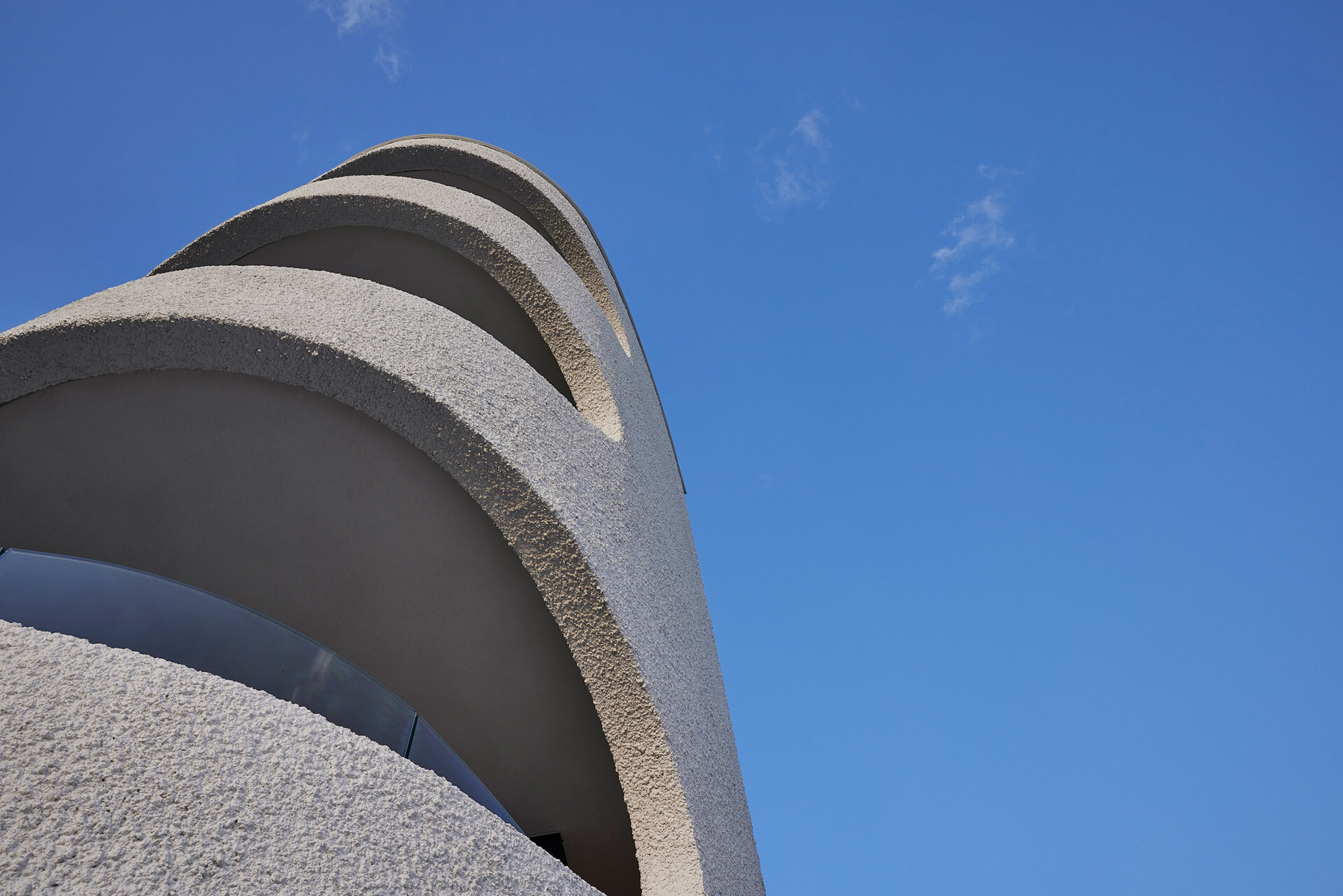 Stucco-rendered masonry gives this building warmth and depth.
