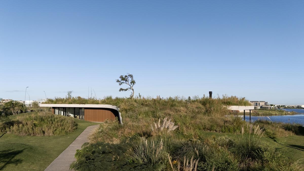 This clubhouse green roof is made up of native plantings that root the building in its context. The plant palette is hardy and low-maintenance, selected to thrive in the region’s climate while offering seasonal variety. As the vegetation matures, the line between roof and garden becomes even blurrier, reinforcing the project's low-impact, land-first philosophy. Where most roofs are treated as leftovers, this one is the centerpiece, a living surface that invites engagement from every angle.