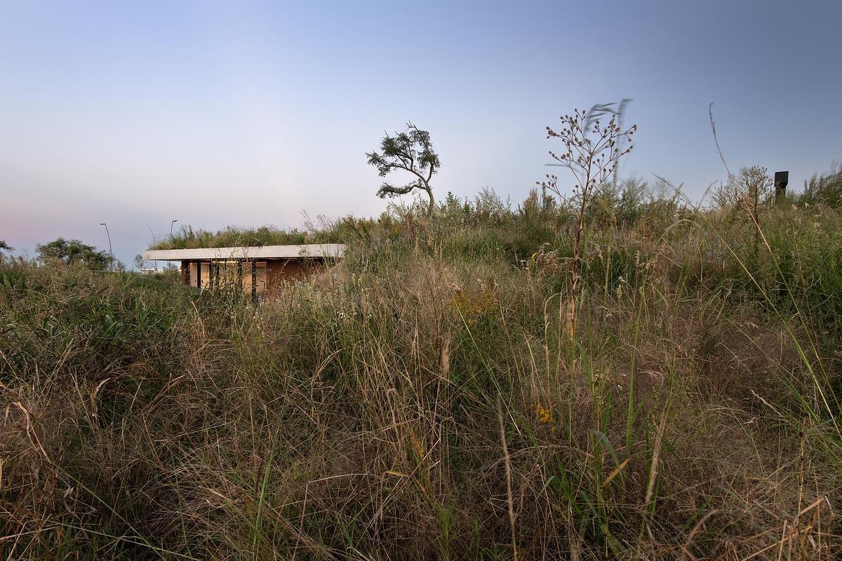 This clubhouse green roof is made up of native plantings that root the building in its context. The plant palette is hardy and low-maintenance, selected to thrive in the region’s climate while offering seasonal variety. As the vegetation matures, the line between roof and garden becomes even blurrier, reinforcing the project's low-impact, land-first philosophy. Where most roofs are treated as leftovers, this one is the centerpiece, a living surface that invites engagement from every angle.