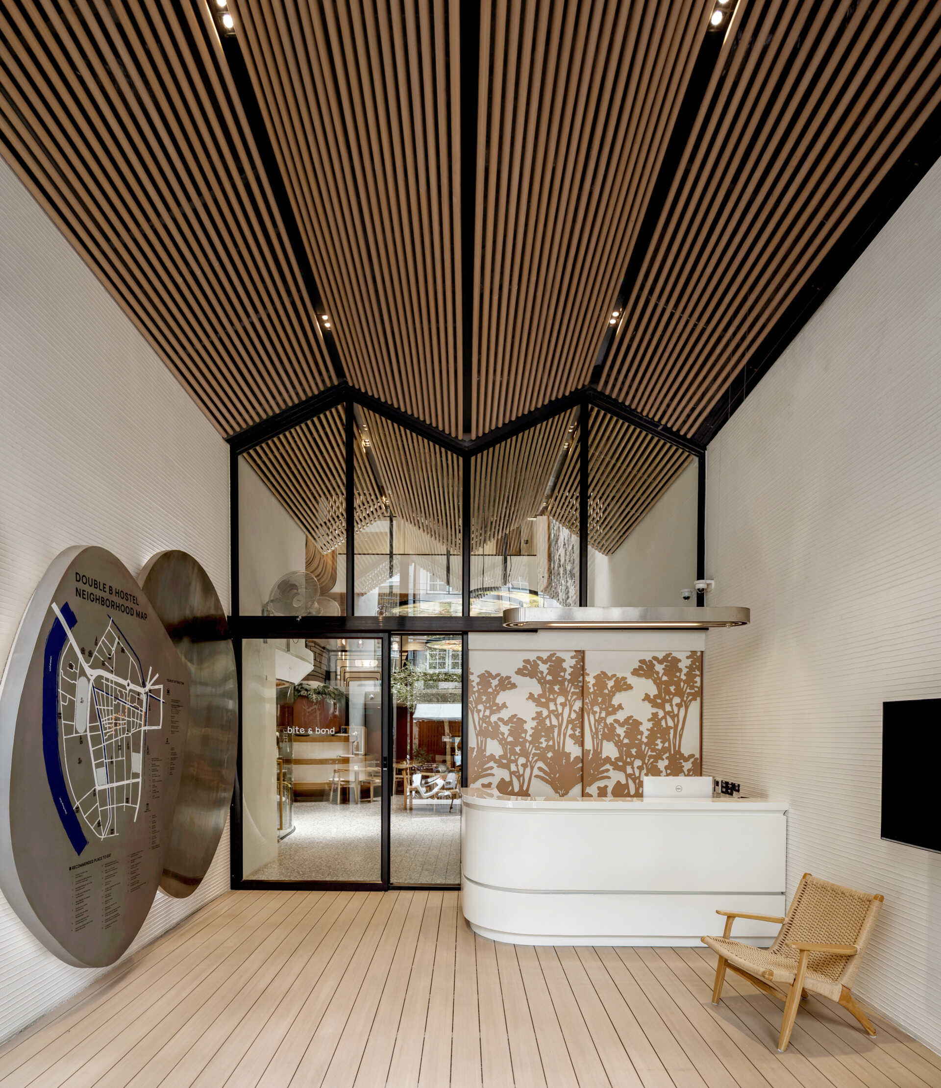 Inside the reception, warm reclaimed timber and natural light create a welcoming space that reflects the hostel’s connection to local artisans and heritage.