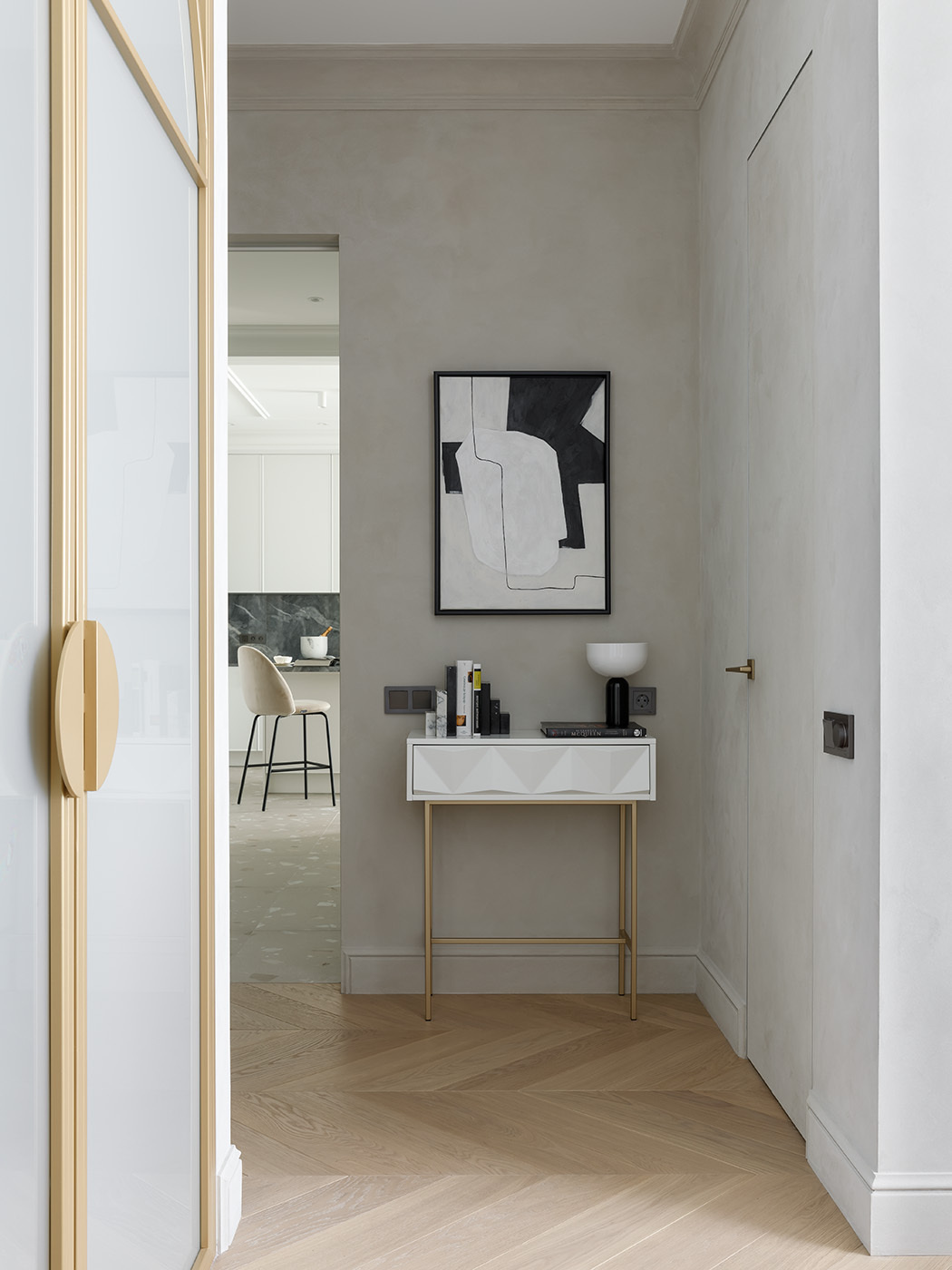 A small console table sits at the entrance to the primary bedroom.