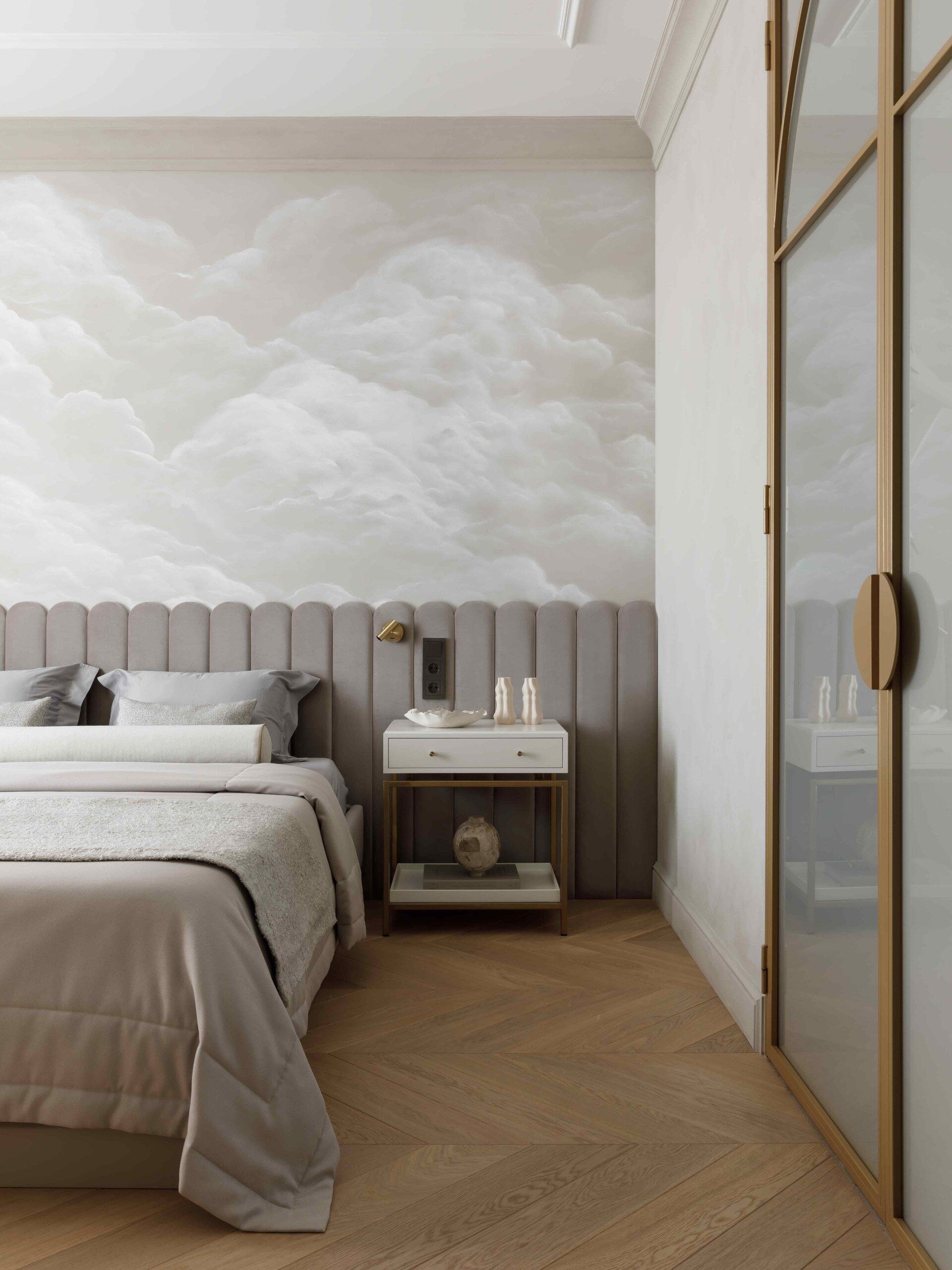 In this bedroom, tranquility takes center stage. A custom wall panel that acts as a headboard and a dry-brush fresco of drifting clouds create a dreamy, atmospheric backdrop. Every detail, down to the soft glow of Danish lighting and handcrafted furniture, feels curated for peace.