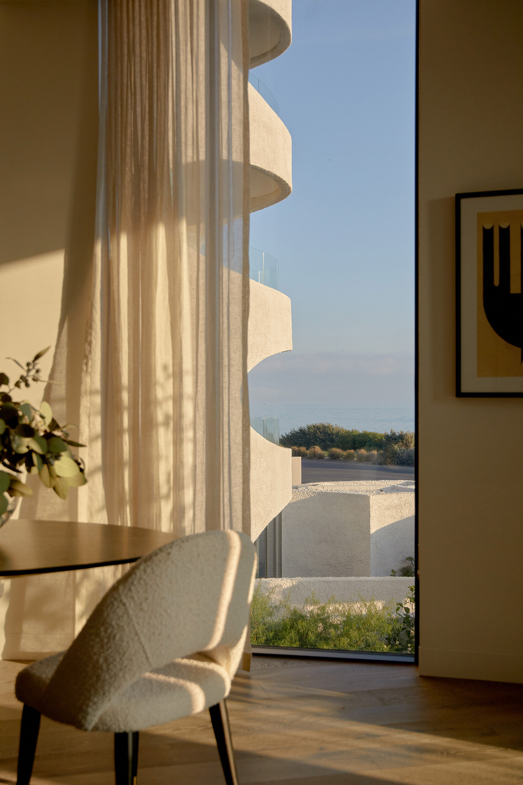 Inside this apartment, the interiors feel just as considered as the architecture. There’s a strong focus on craftsmanship, with bespoke joinery and natural materials used throughout. The layouts take advantage of the site’s green spine, offering multiple aspects to the beach and garden, great natural light, and passive airflow.