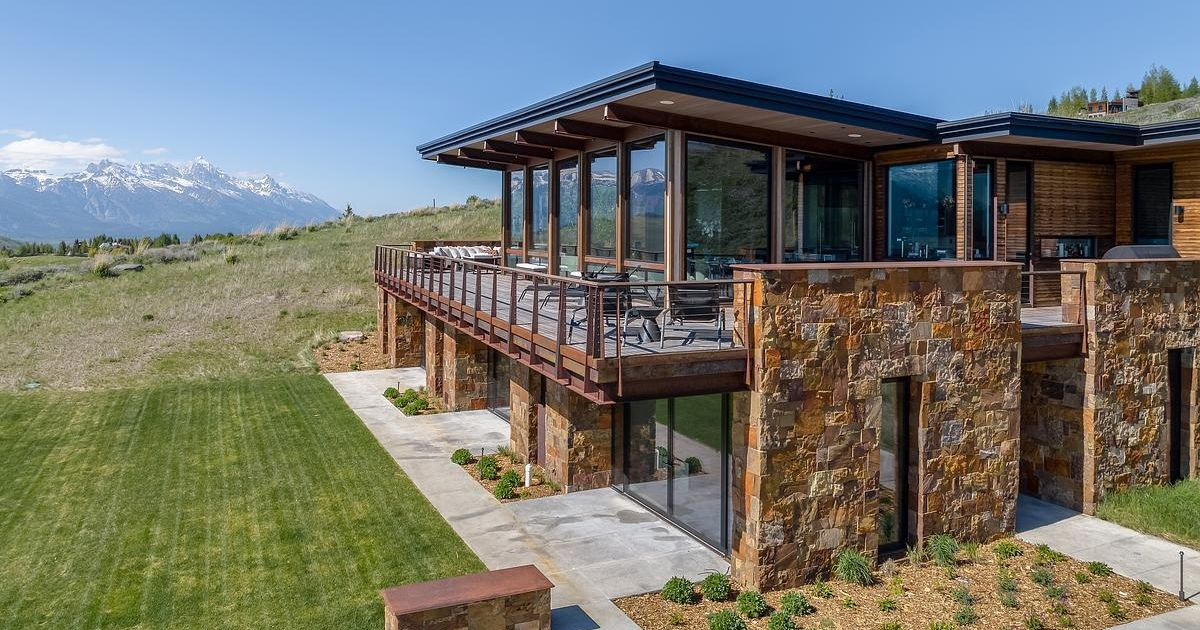 This Grass-Roofed Home With Stone Walls Feels Like It Grew From the Mountain