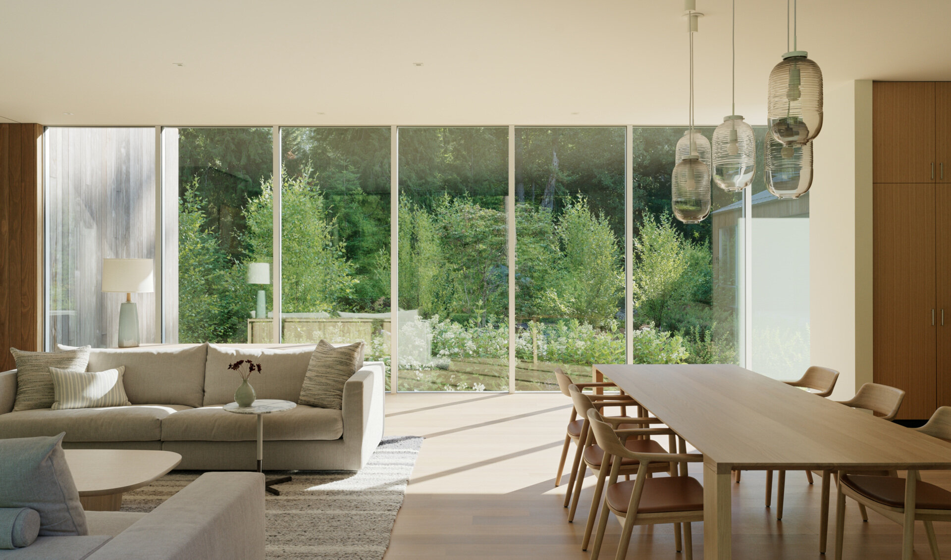 Just off the living space, this dining area continues the open layout, while the clean-lined furnishings are designed to complement the architecture without overpowering it. This is a space that invites lingering conversations and unhurried meals.