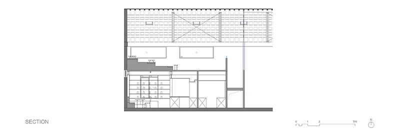 The architectural drawings outline how a 1950s red-brick warehouse was restructured into a modern cafe without compromising its original form.