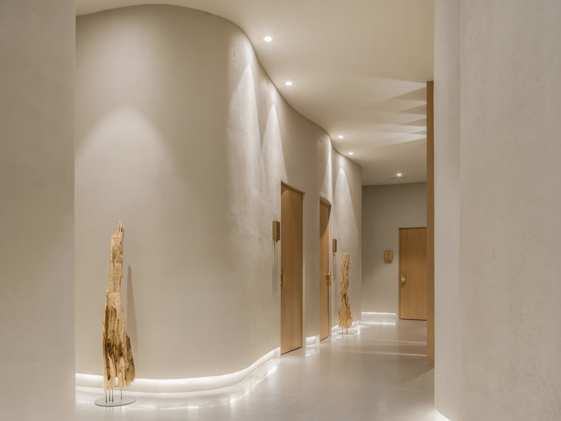 Step into a sensory cocoon on the first floor of SIAM SPA, where flowing corridors, sand-toned textures, and curved walls evoke the feeling of a peaceful, natural cave. Intimate lighting and tactile materials create a tranquil setting for massage and deep relaxation.